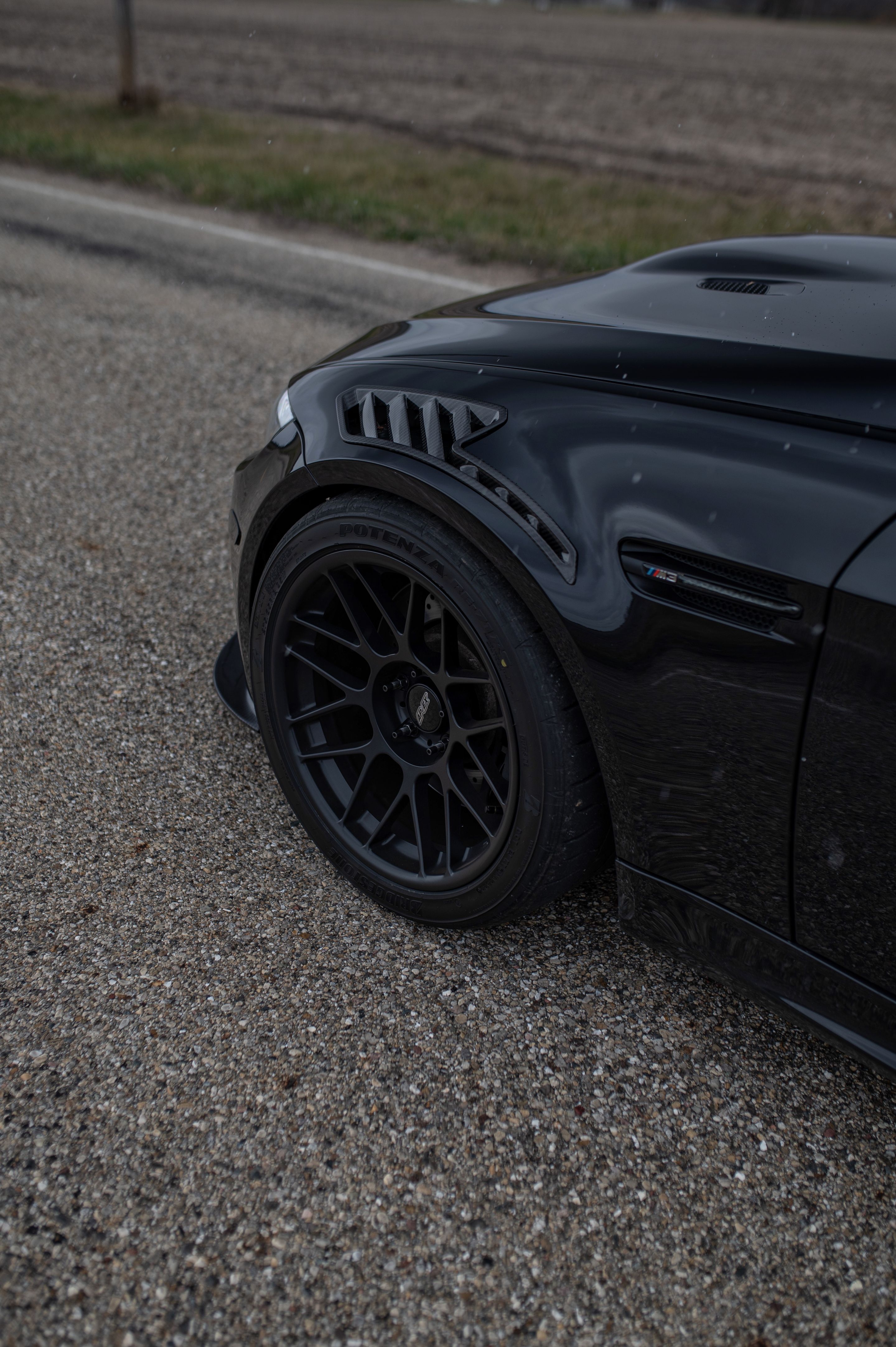 Black BMW E90 Sedan M3 with 18" ARC-8 Apex wheels in Satin Black