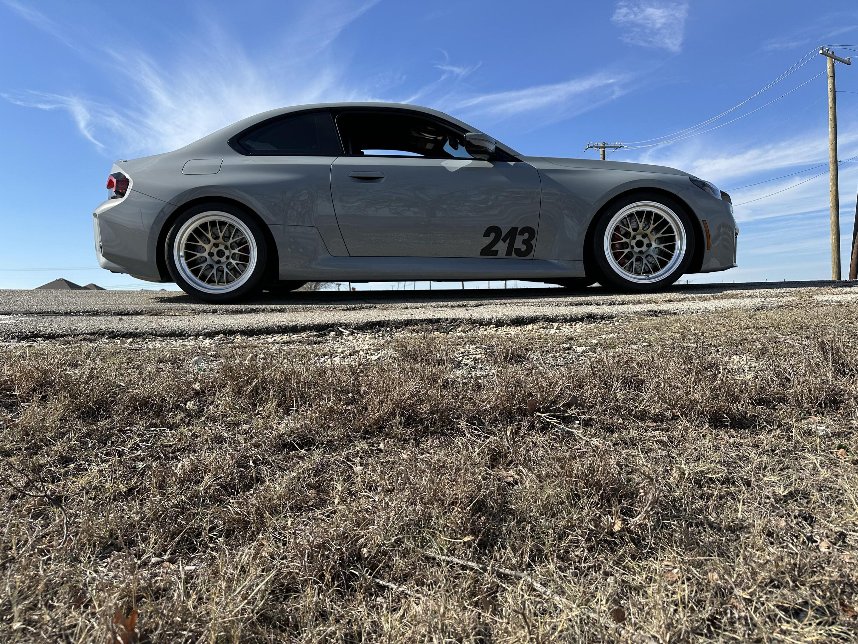 Grey BMW G87 M2 with 19" ML-10RT Apex wheels in Machined Lip Gloss Motorsport Gold