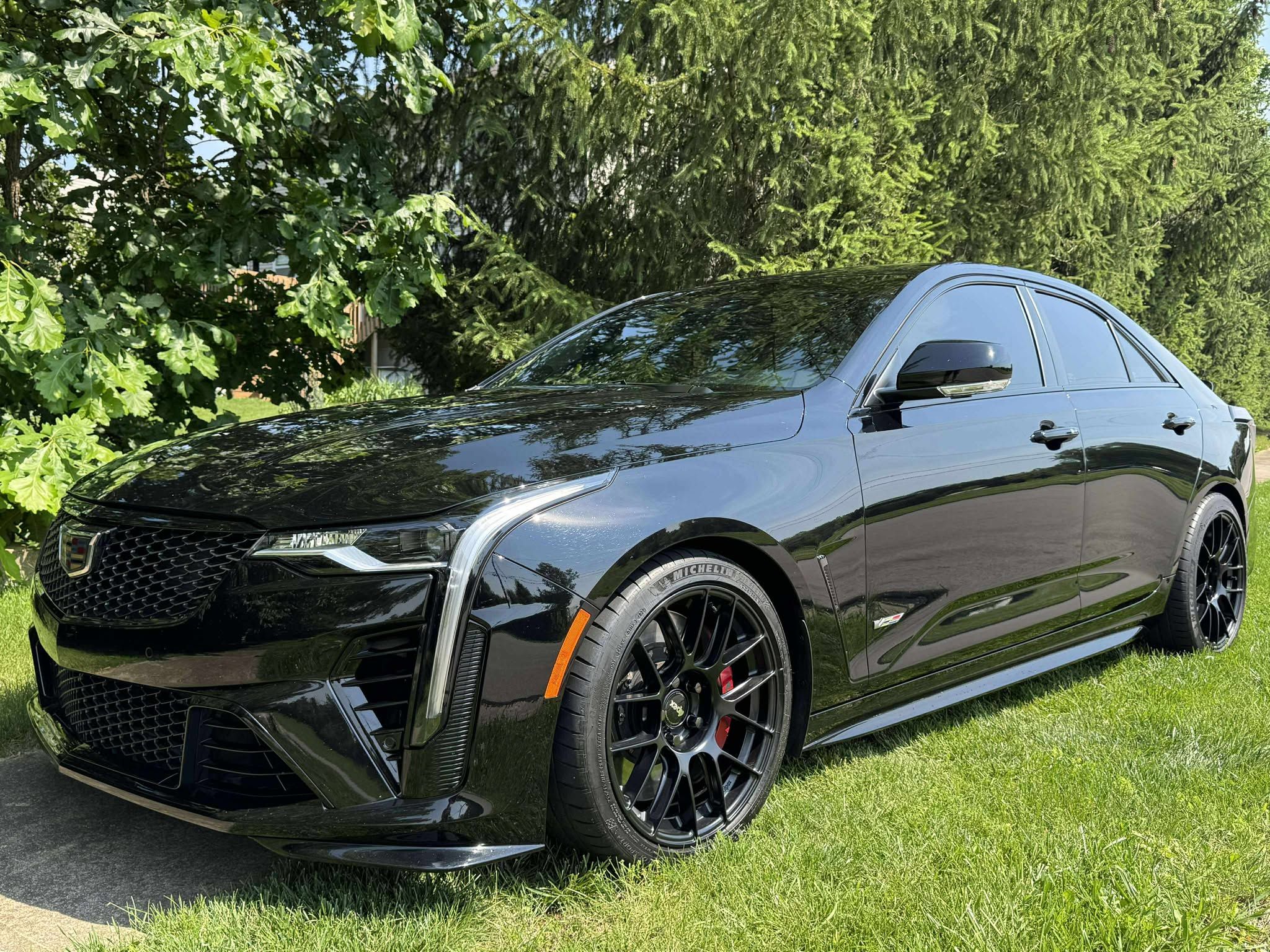 Black Cadillac CT4-V Blackwing with 18" EC-7RS Apex wheels in Satin Black