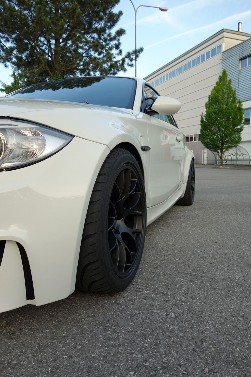 White BMW E82 1M with 18" EC-7 Apex wheels in Satin Black