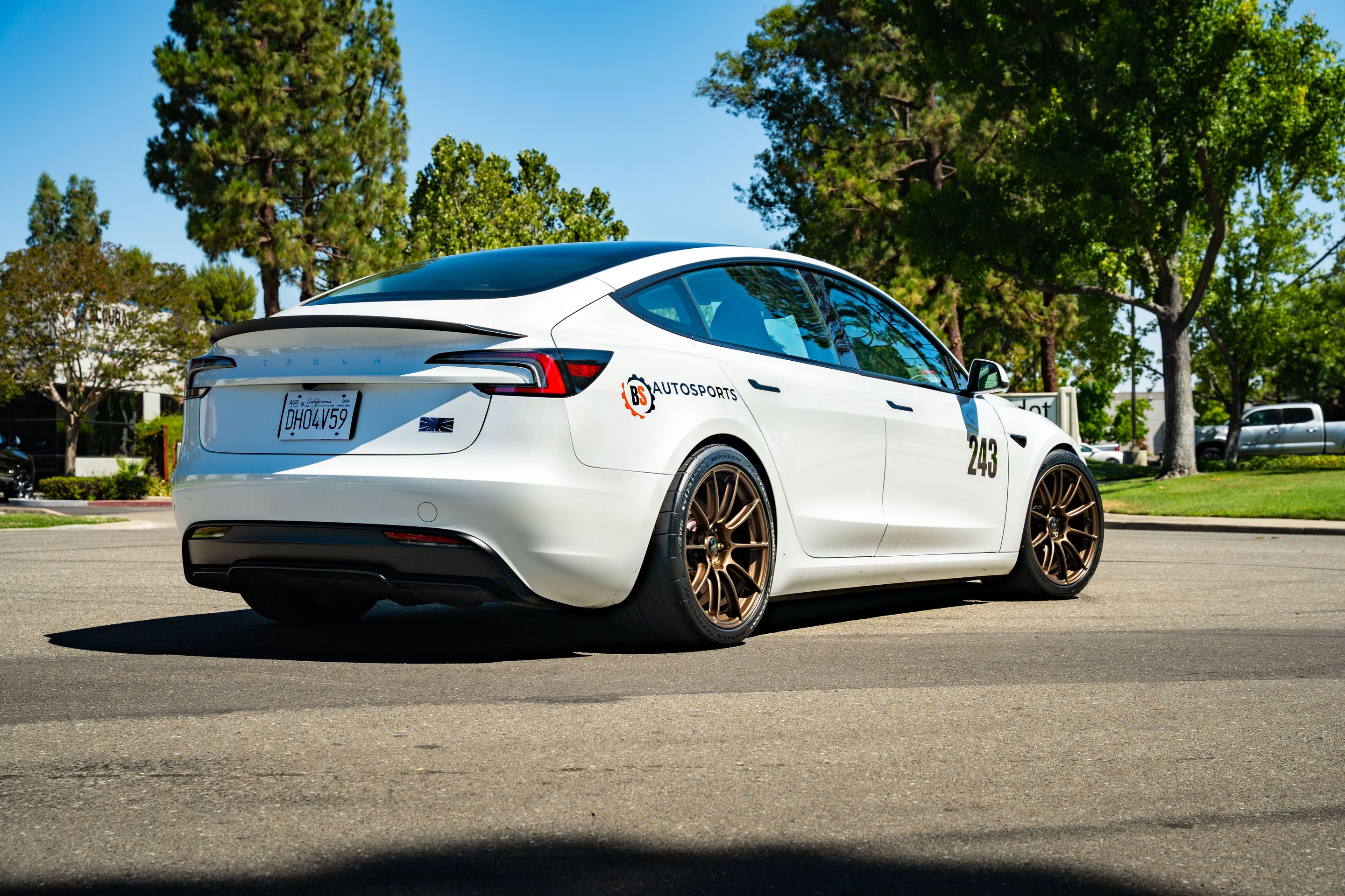 White Tesla Model 3 with 19" SM-10RS Apex wheels in Satin Bronze