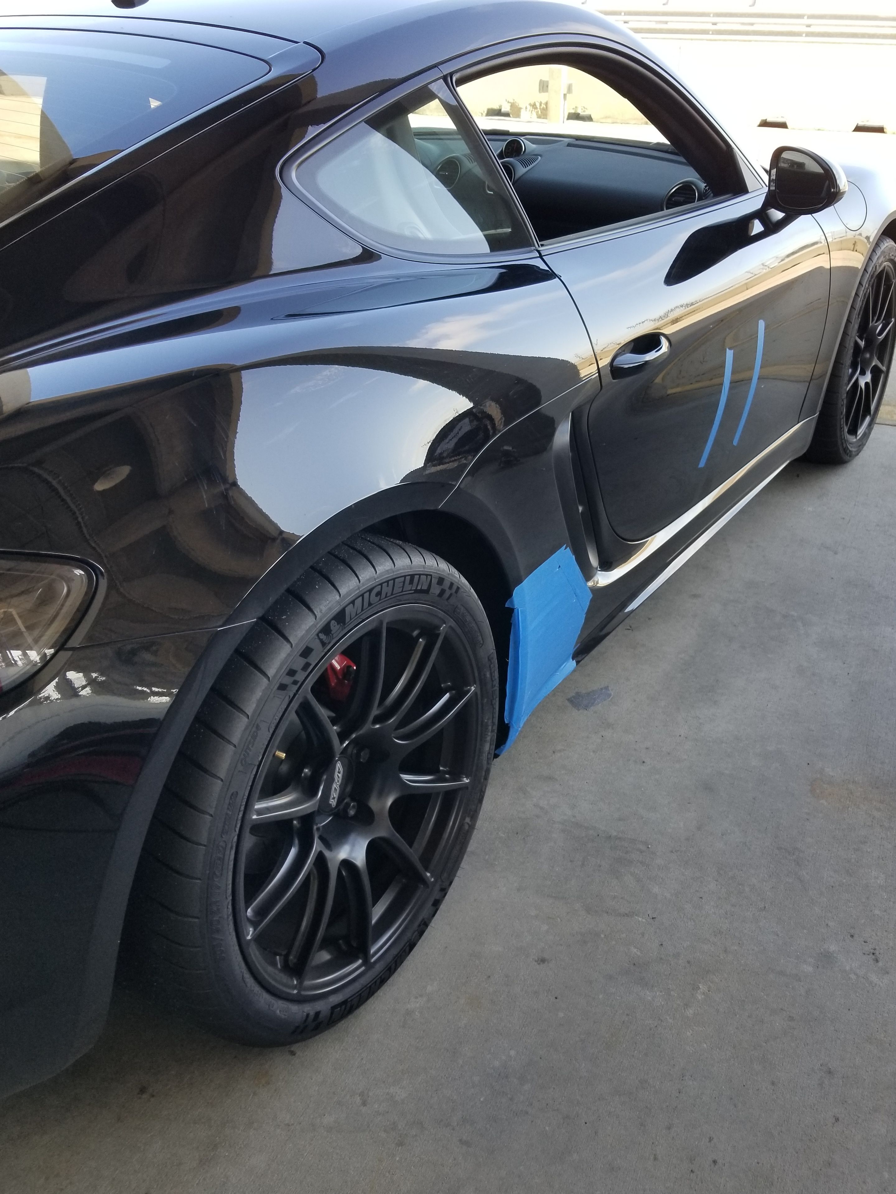 Black Porsche 718 Cayman GTS 2.5L with 19" SM-10 Apex wheels in Satin Black