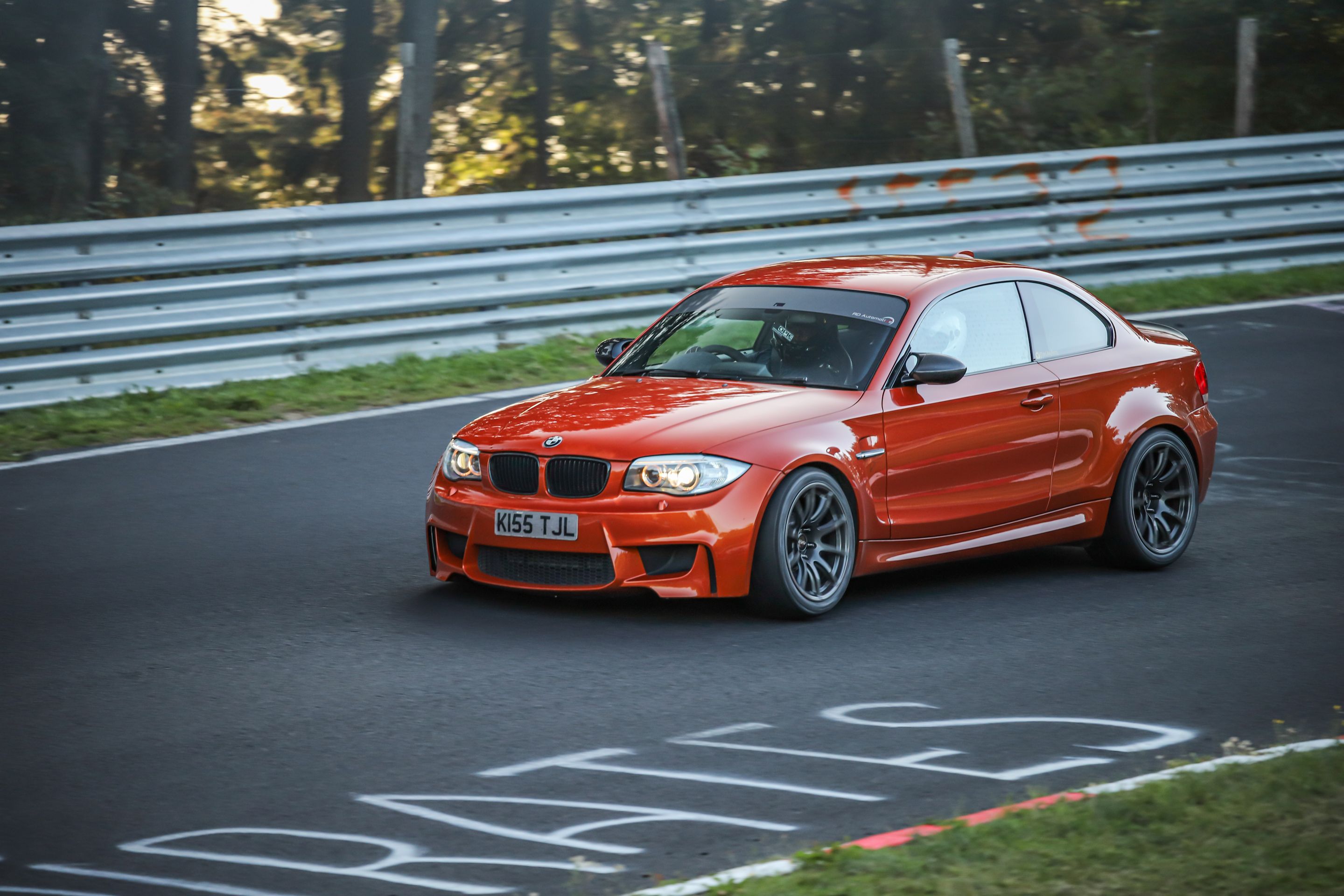 Orange BMW E82 1M with 18" SM-10 Apex wheels in Anthracite