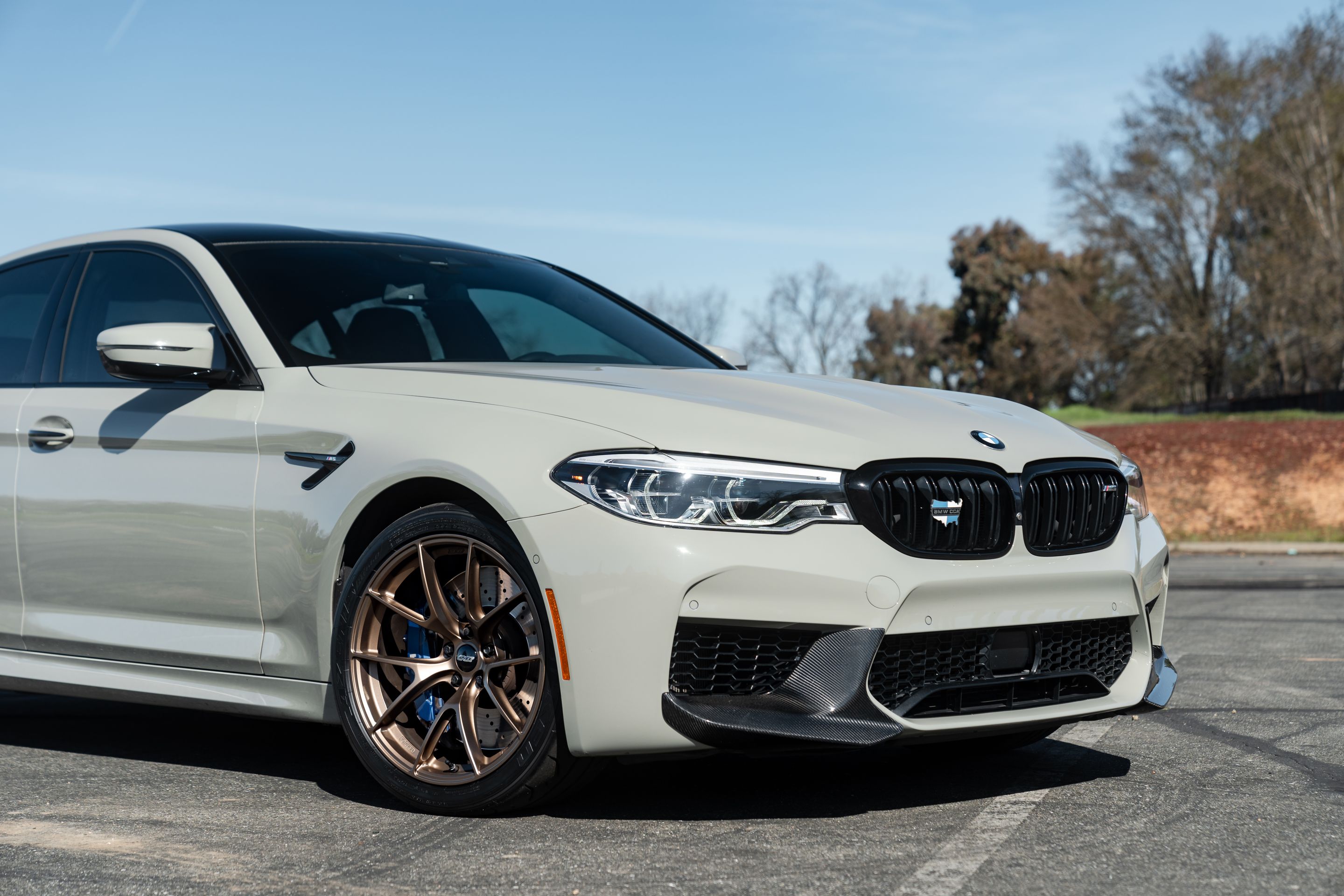 Grey BMW F90 M5 with 19" VS-5RS Apex wheels in Satin Bronze