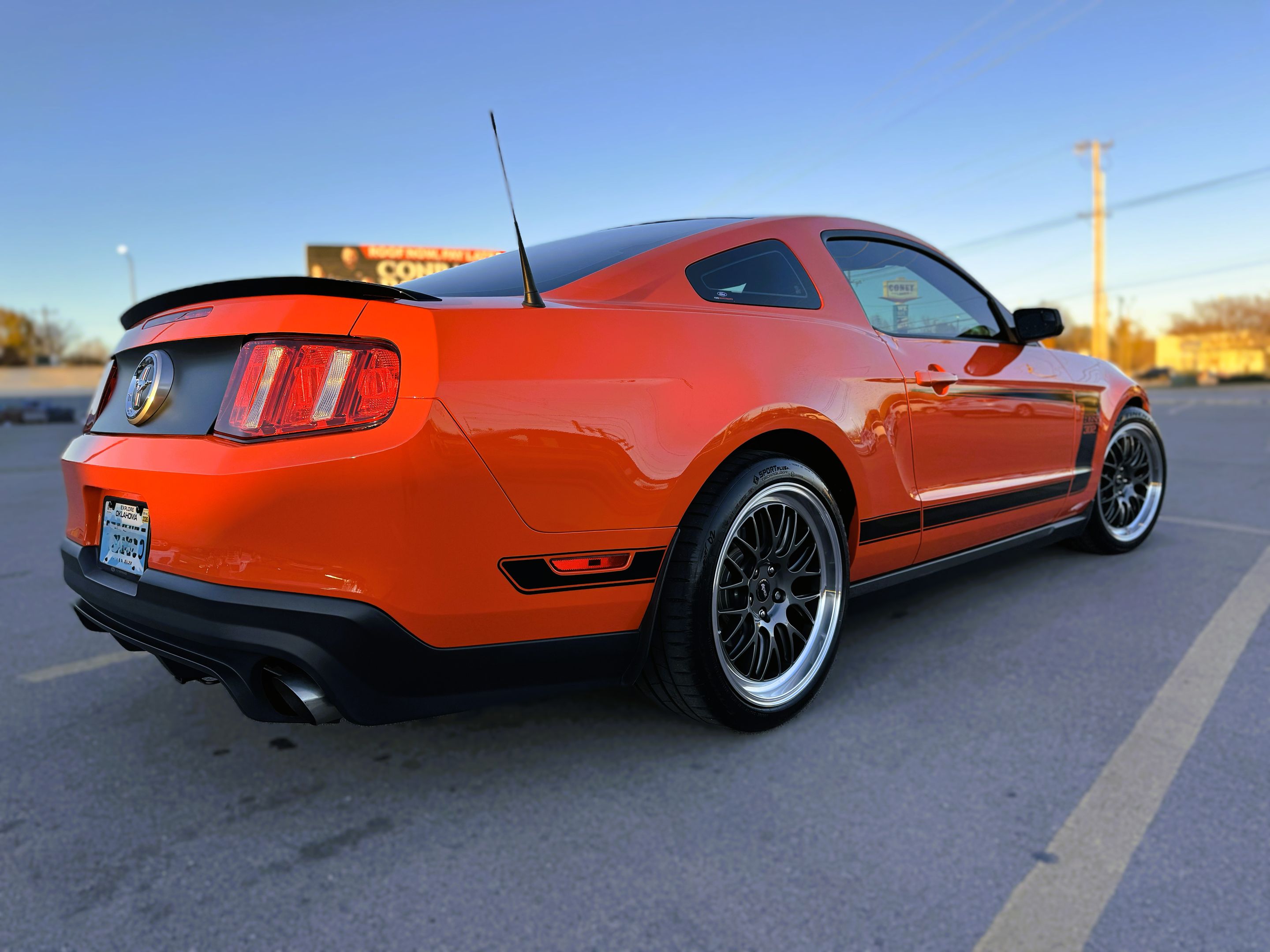 Orange Ford S197 Mustang Boss 302 with 19" ML-10RT Apex wheels in Machined Lip Anthracite