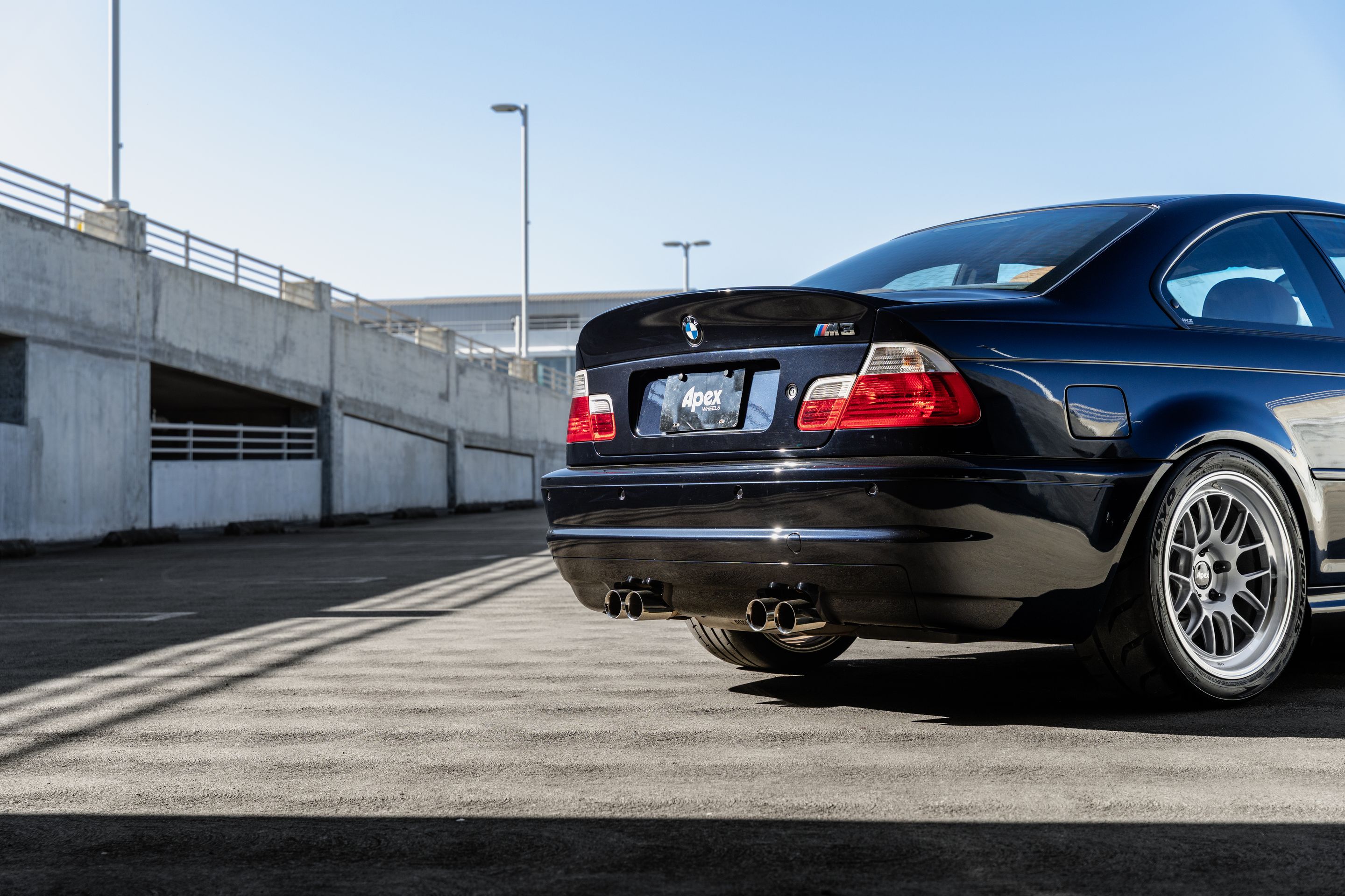 Black BMW E46 M3 with 18" ML-7RT Apex wheels in Machined Lip Race Silver