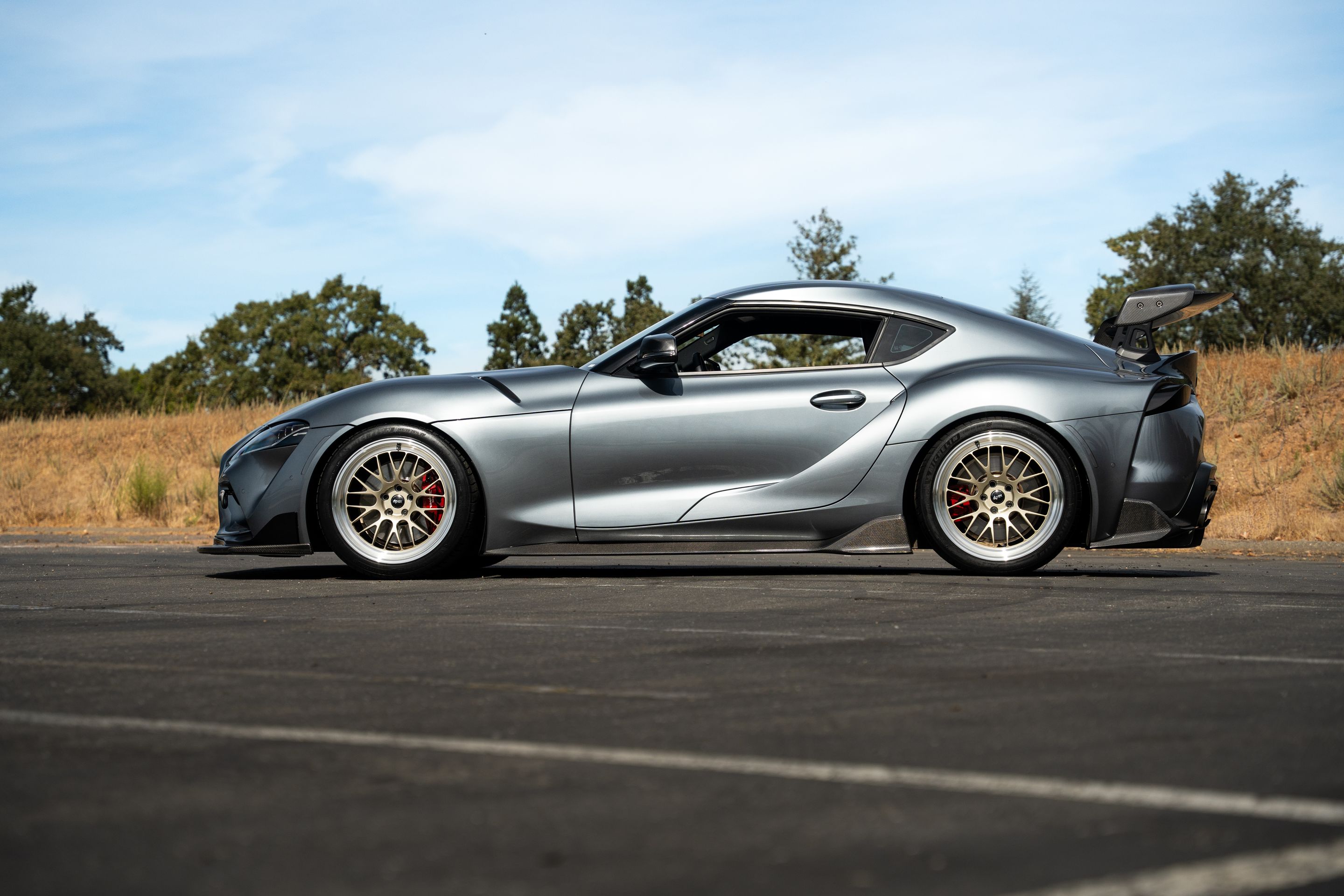 Grey Toyota GR Supra with 19" ML-10RT Apex wheels in Machined Lip Gloss Motorsport Gold