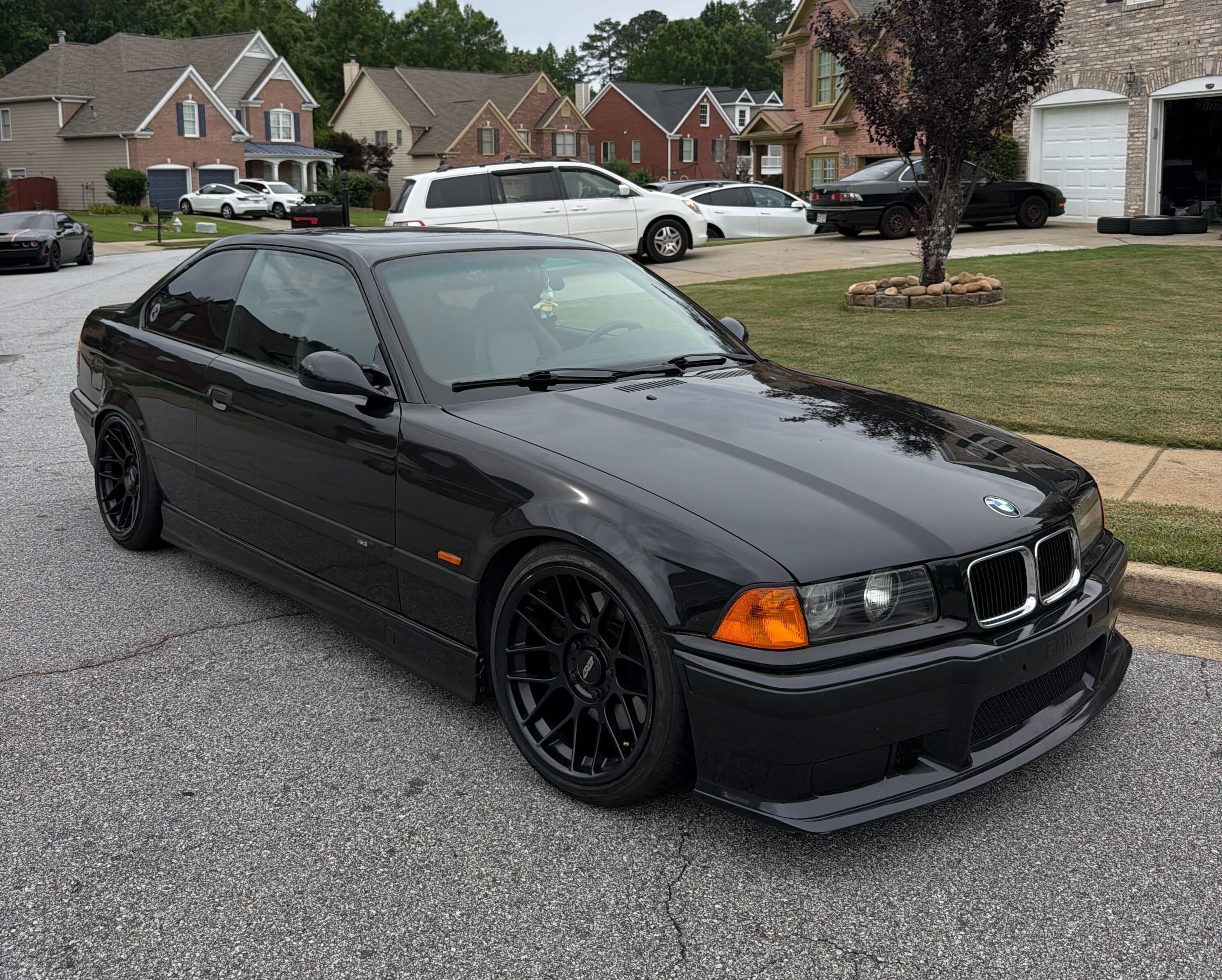 Black BMW E36 M3 with 17" ARC-8 Apex wheels in Satin Black