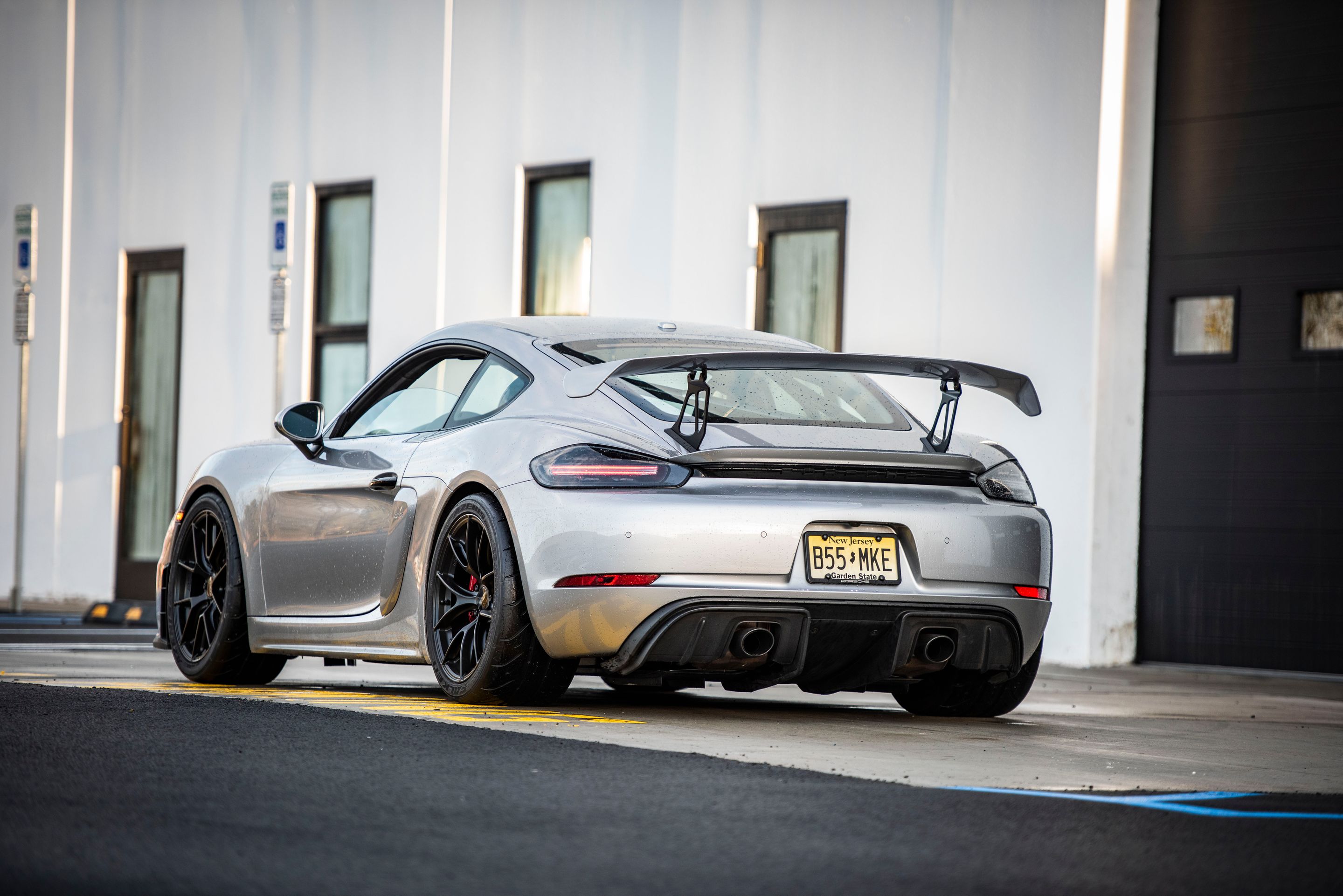 Silver Porsche 718 Cayman GT4 with 19" VS-5RS Apex wheels in Satin Black