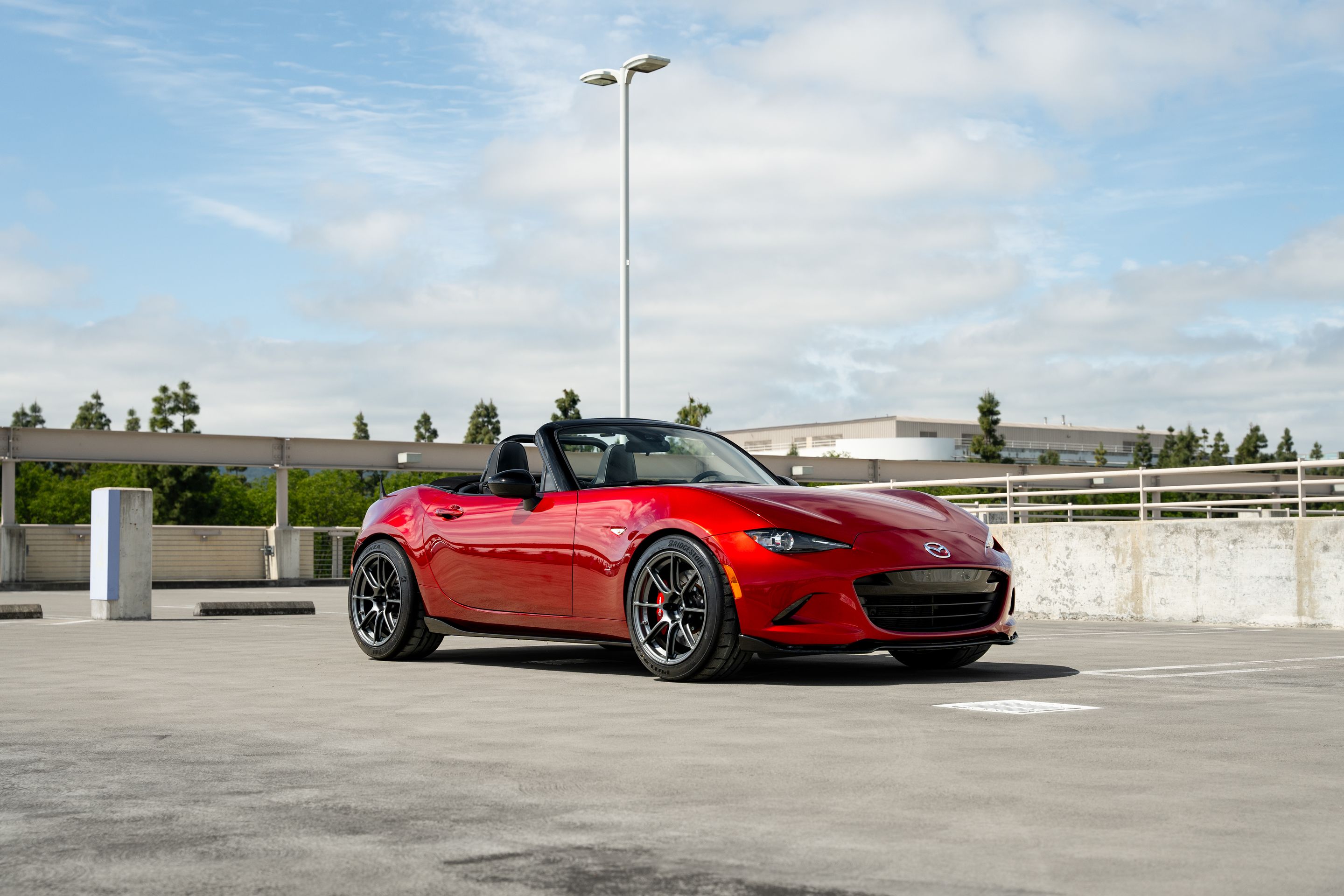 Red Mazda ND MX-5 Miata with 17" SM-8RS Apex wheels in Anthracite