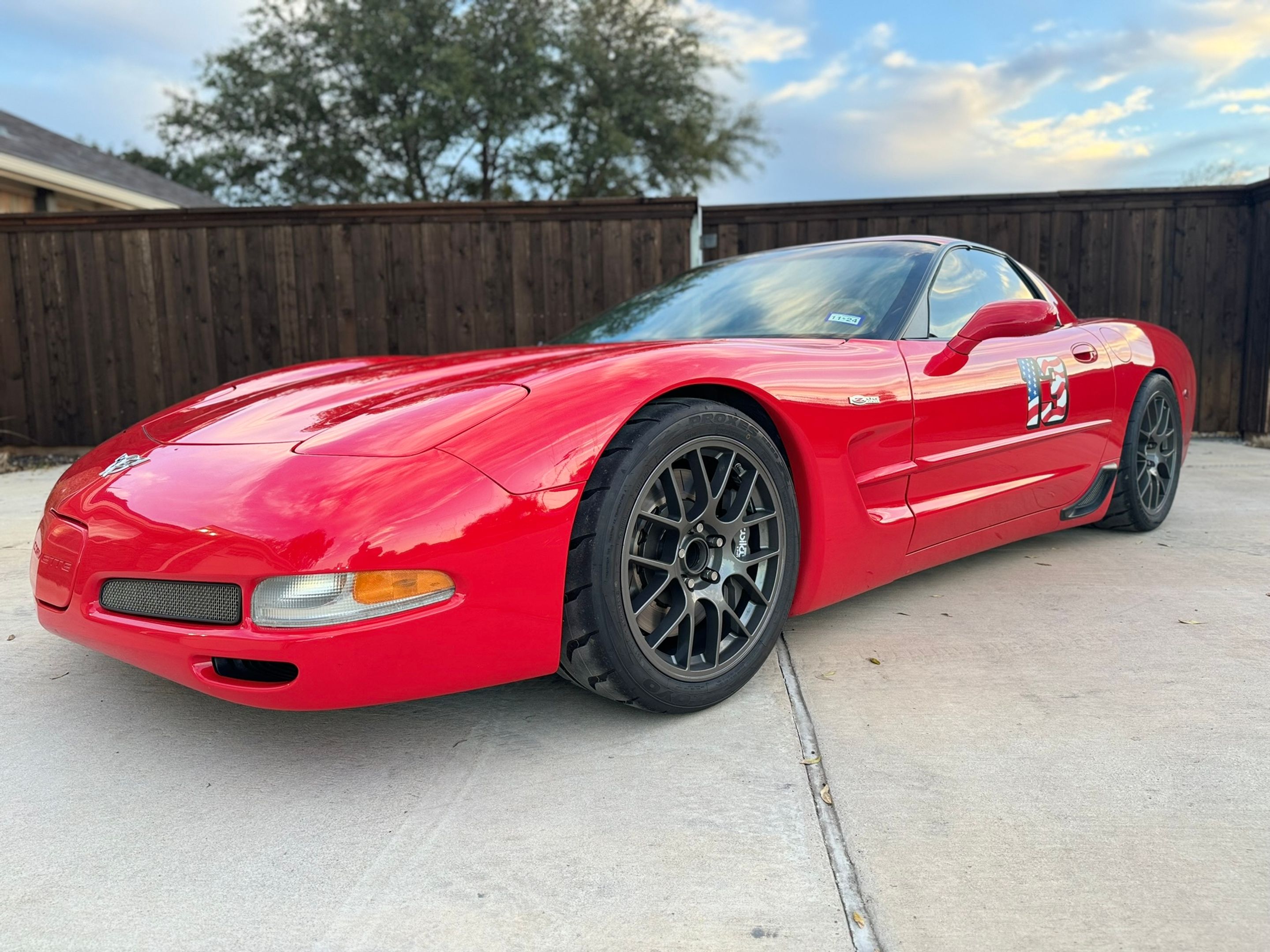 Red Chevrolet C5 Corvette Z06 with 18" EC-7 Apex wheels in Anthracite