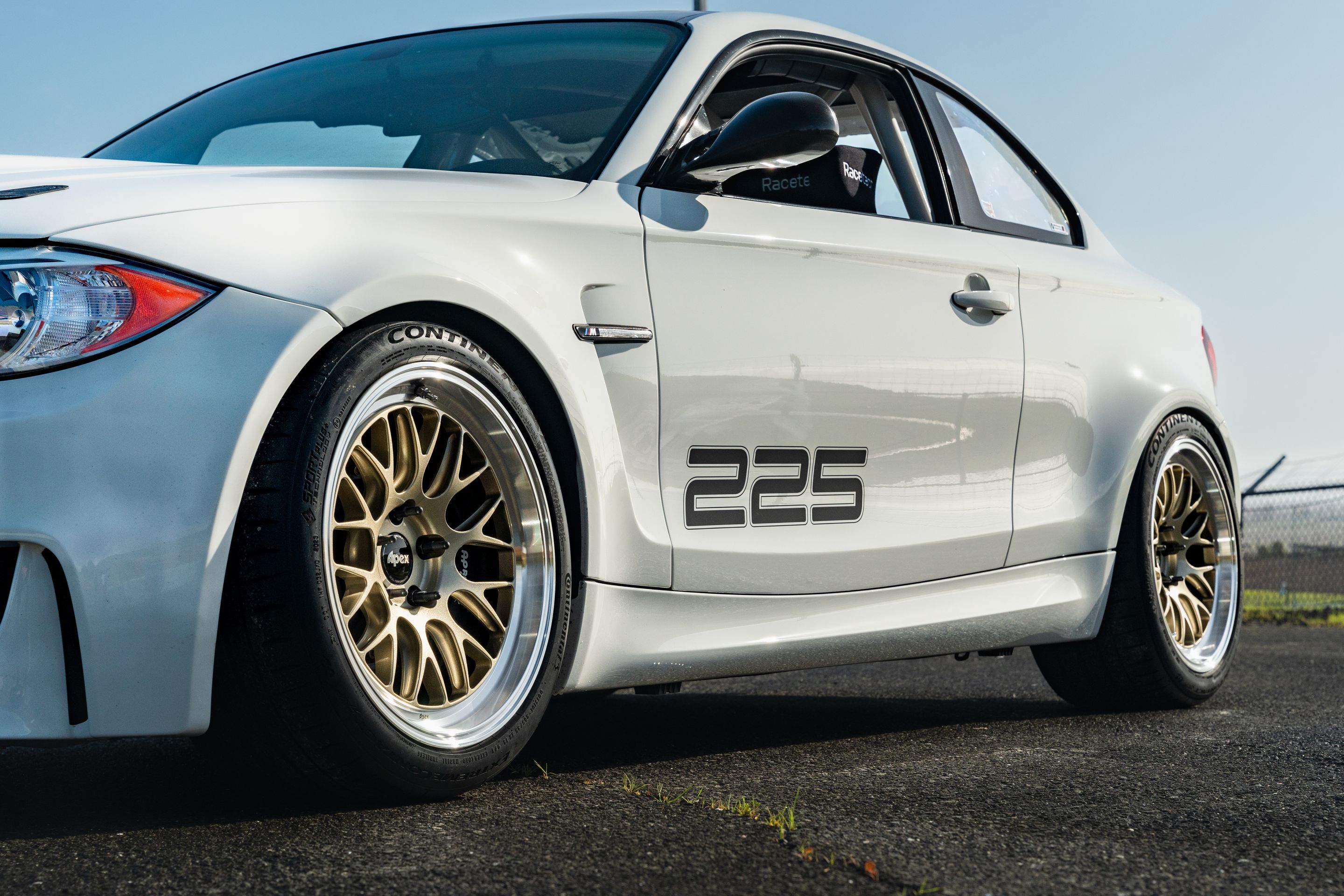 White BMW E82 1M with 18" ML-10RT Apex wheels in Machined Lip Gloss Motorsport Gold