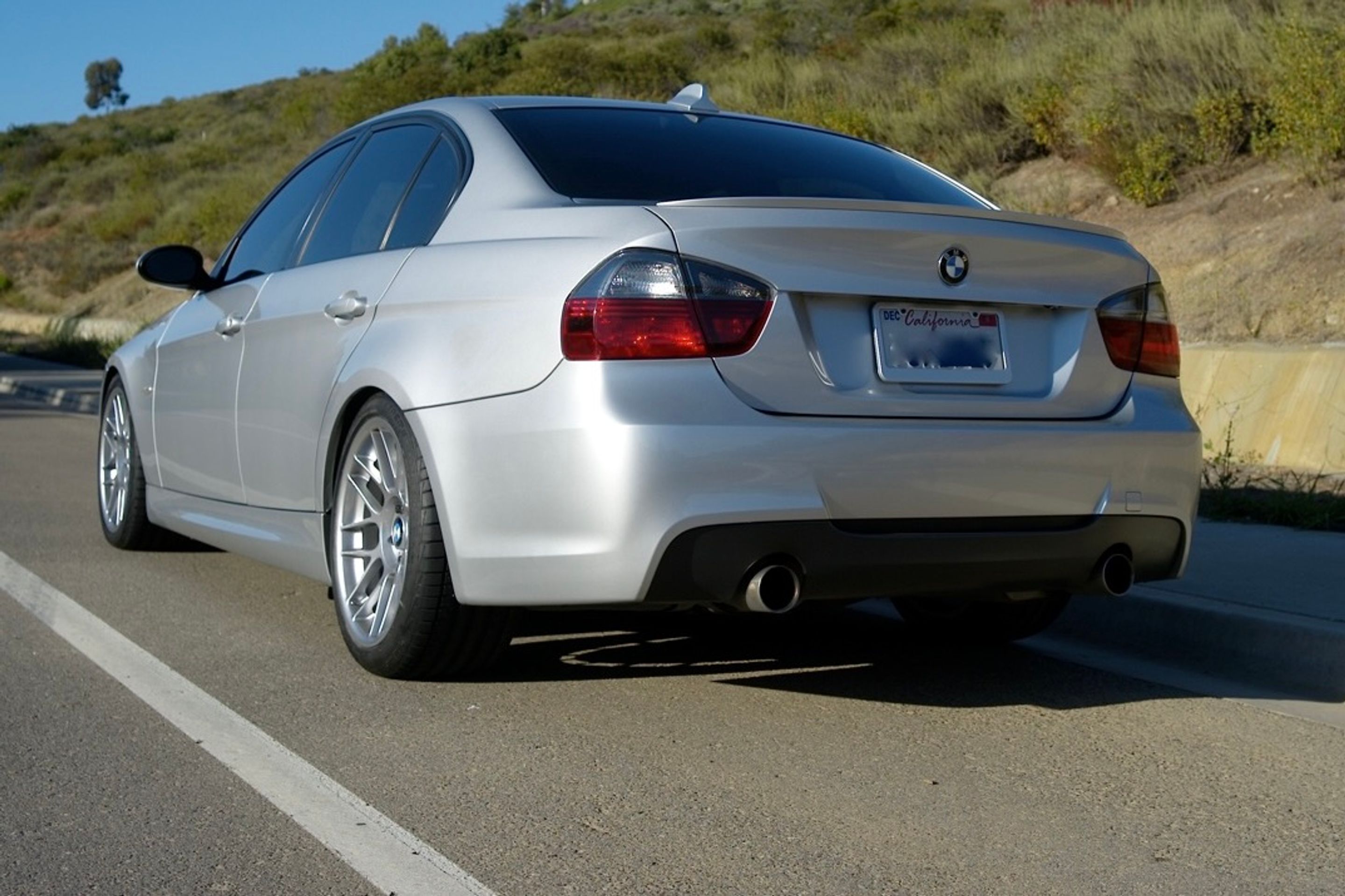 Silver BMW E90 Sedan 3 Series with 18" ARC-8 Apex wheels in Hyper Black