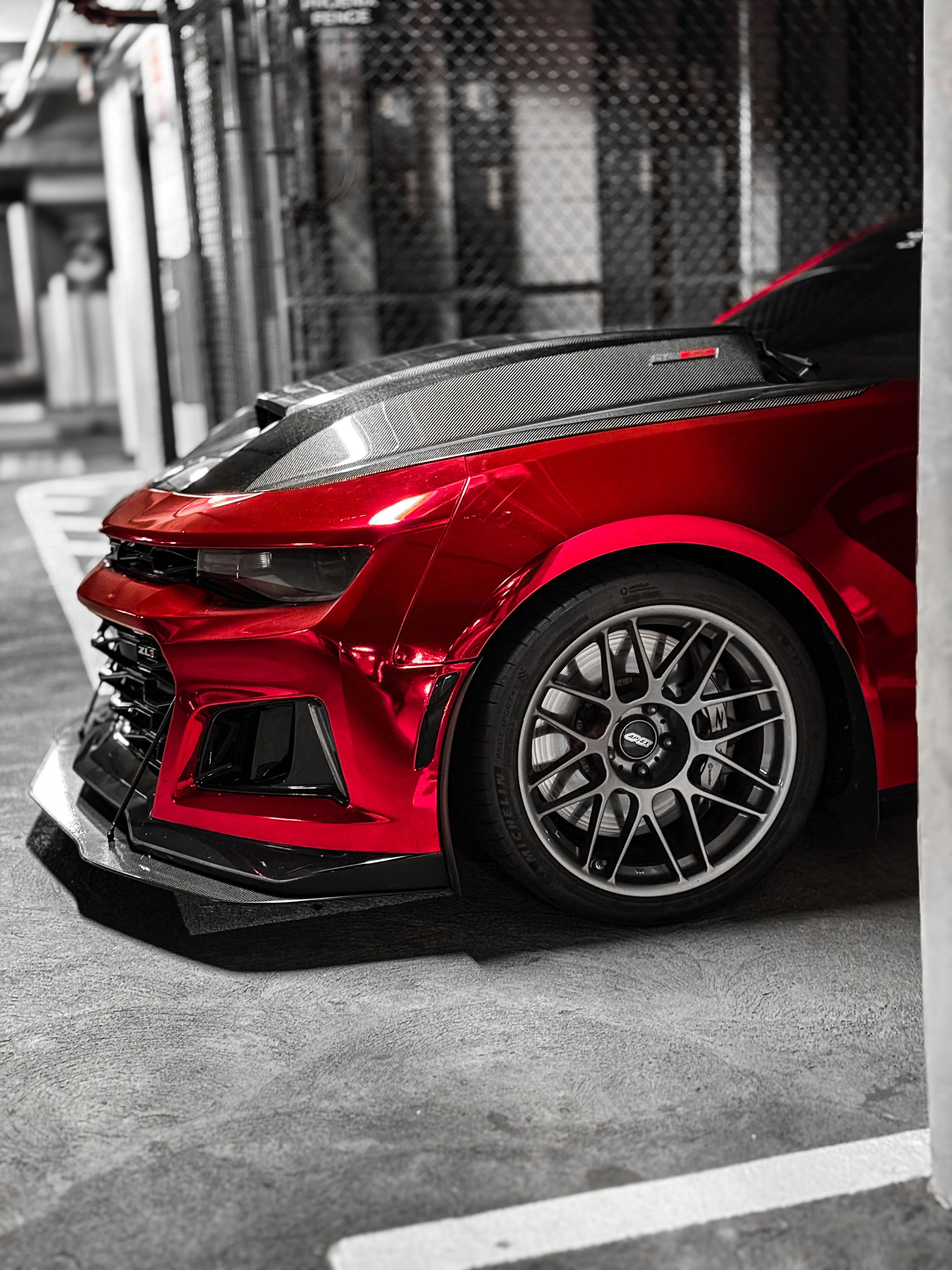 Red Chevrolet 6th Gen Camaro ZL1 with 19" ARC-8 Apex wheels in Anthracite