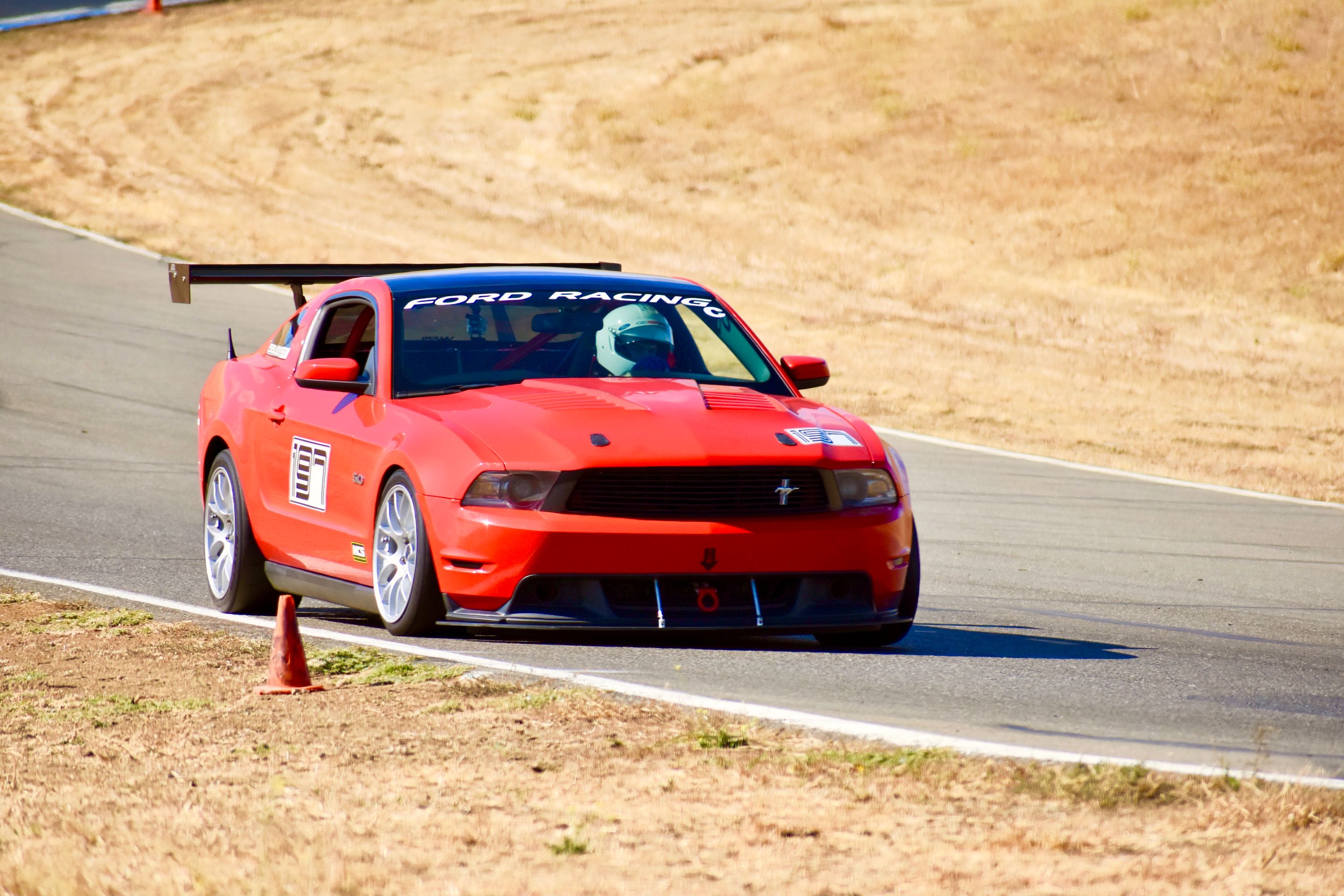 Red Ford S197 Mustang GT with 18" EC-7 Apex wheels in Race Silver