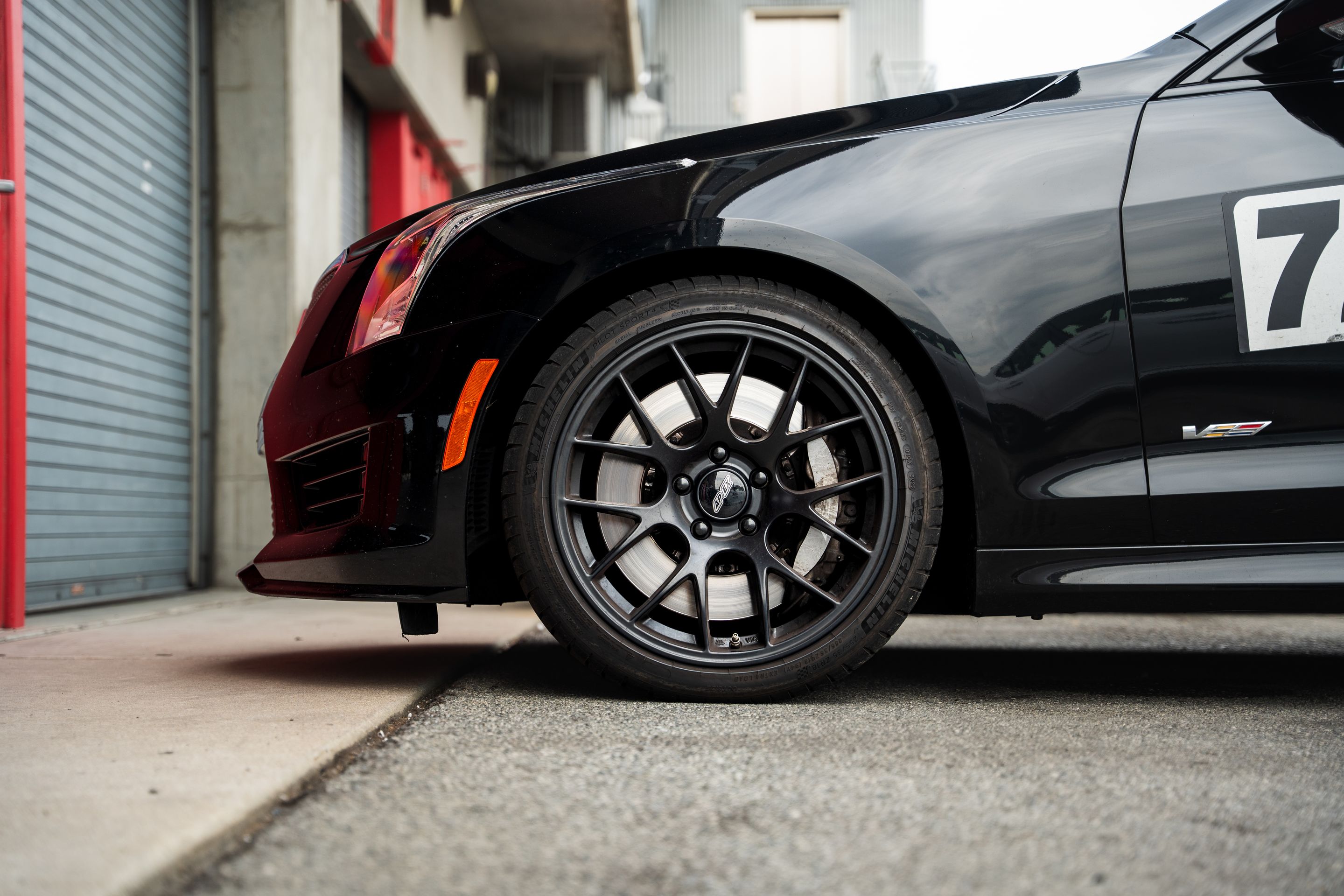Black Cadillac ATS-V with 18" EC-7 Apex wheels in Satin Black