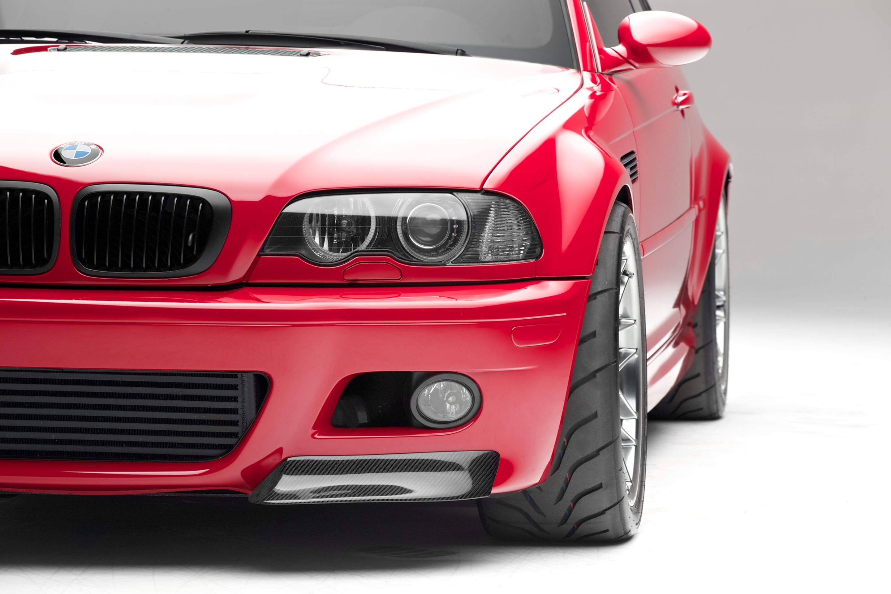 Red BMW E46 M3 with 18" ARC-8 Apex wheels in Hyper Black