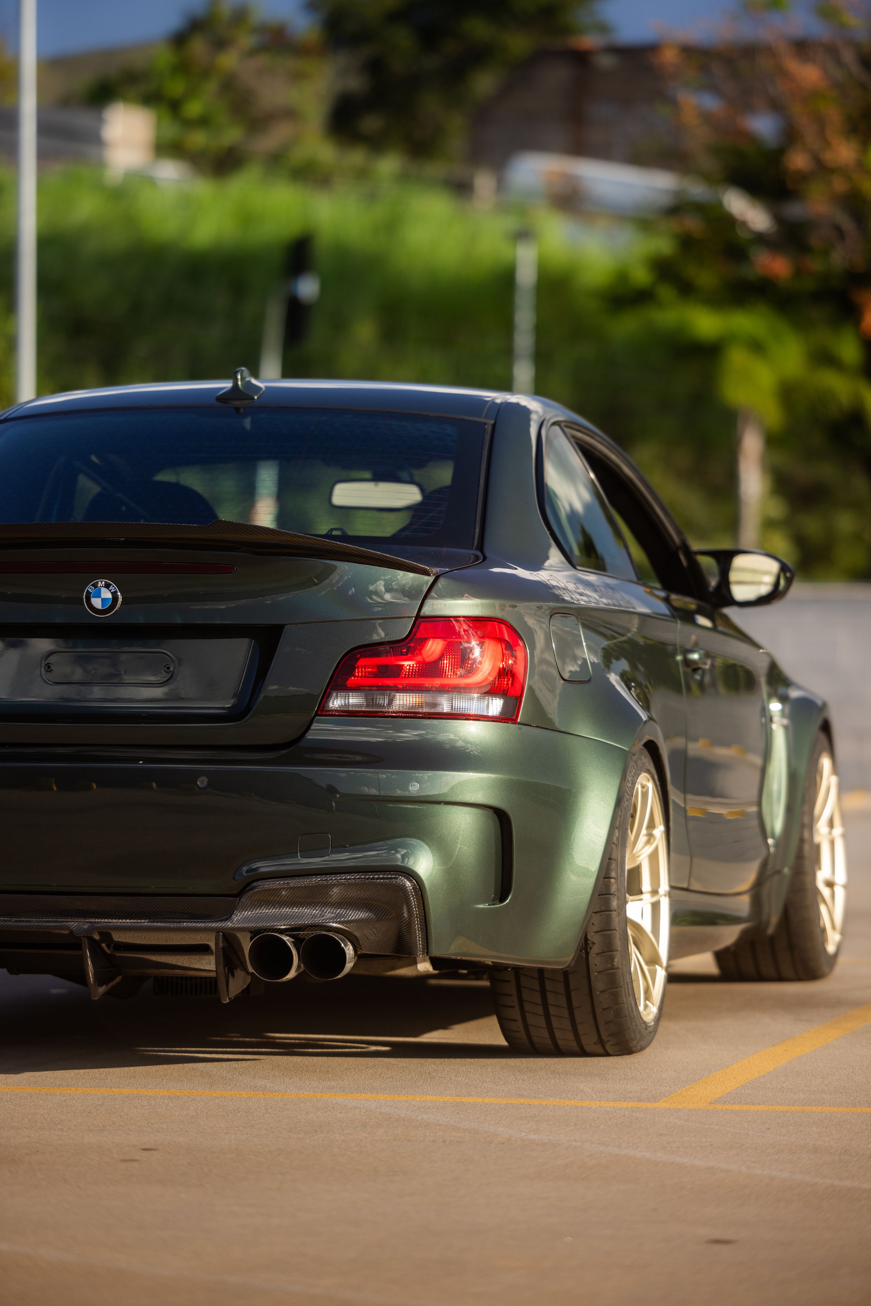 Green BMW E82 1M with 18" VS-5RS Apex wheels in Motorsport Gold