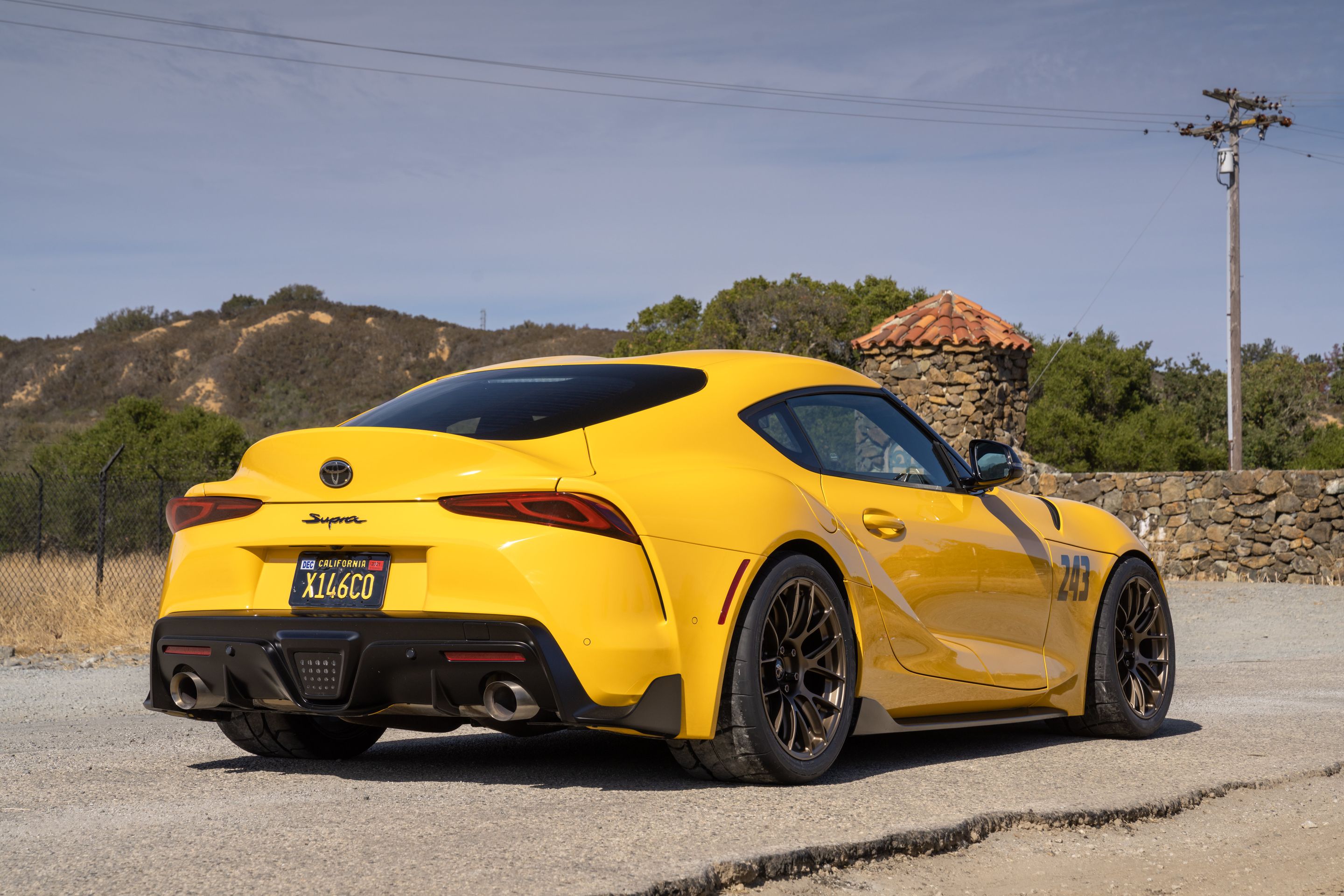 Yellow Toyota GR Supra with 18" EC-7RS Apex wheels in Satin Bronze