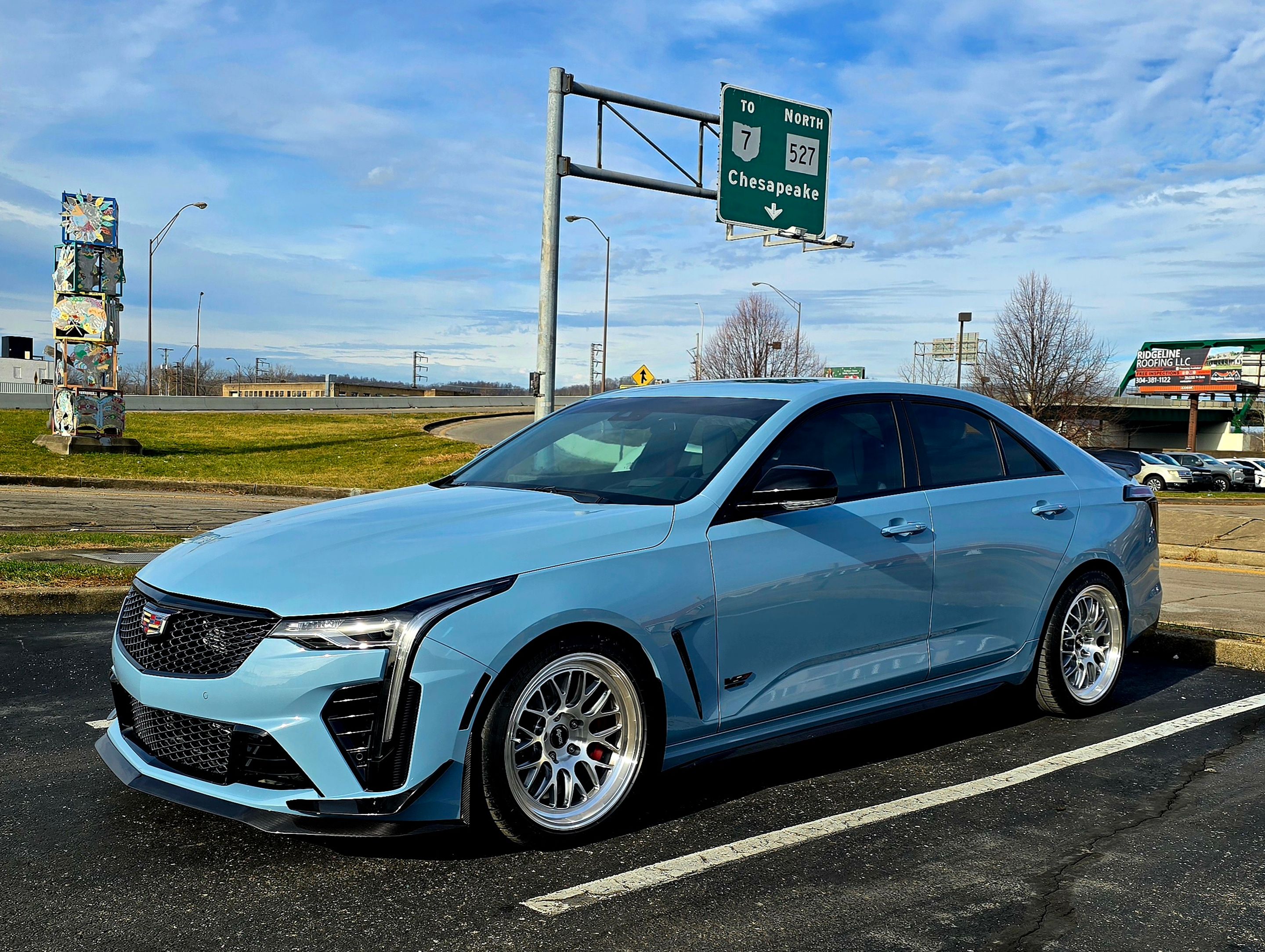 Blue Cadillac CT4-V Blackwing with 18" ML-10RT Apex wheels in Brushed Clear