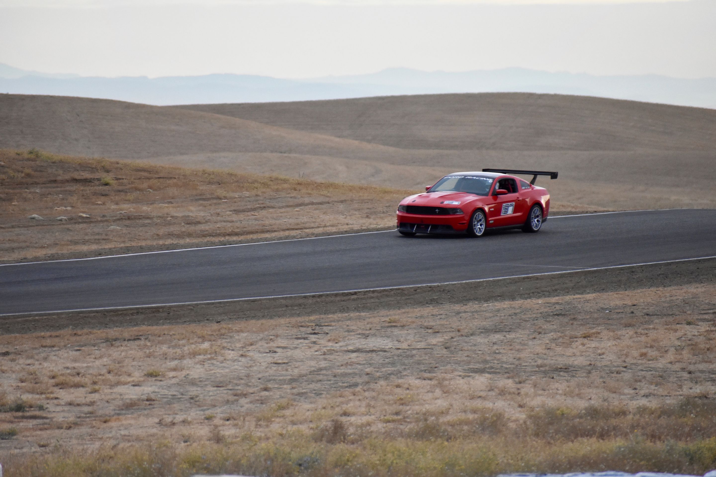 Red Ford S197 Mustang GT with 18" EC-7 Apex wheels in Race Silver