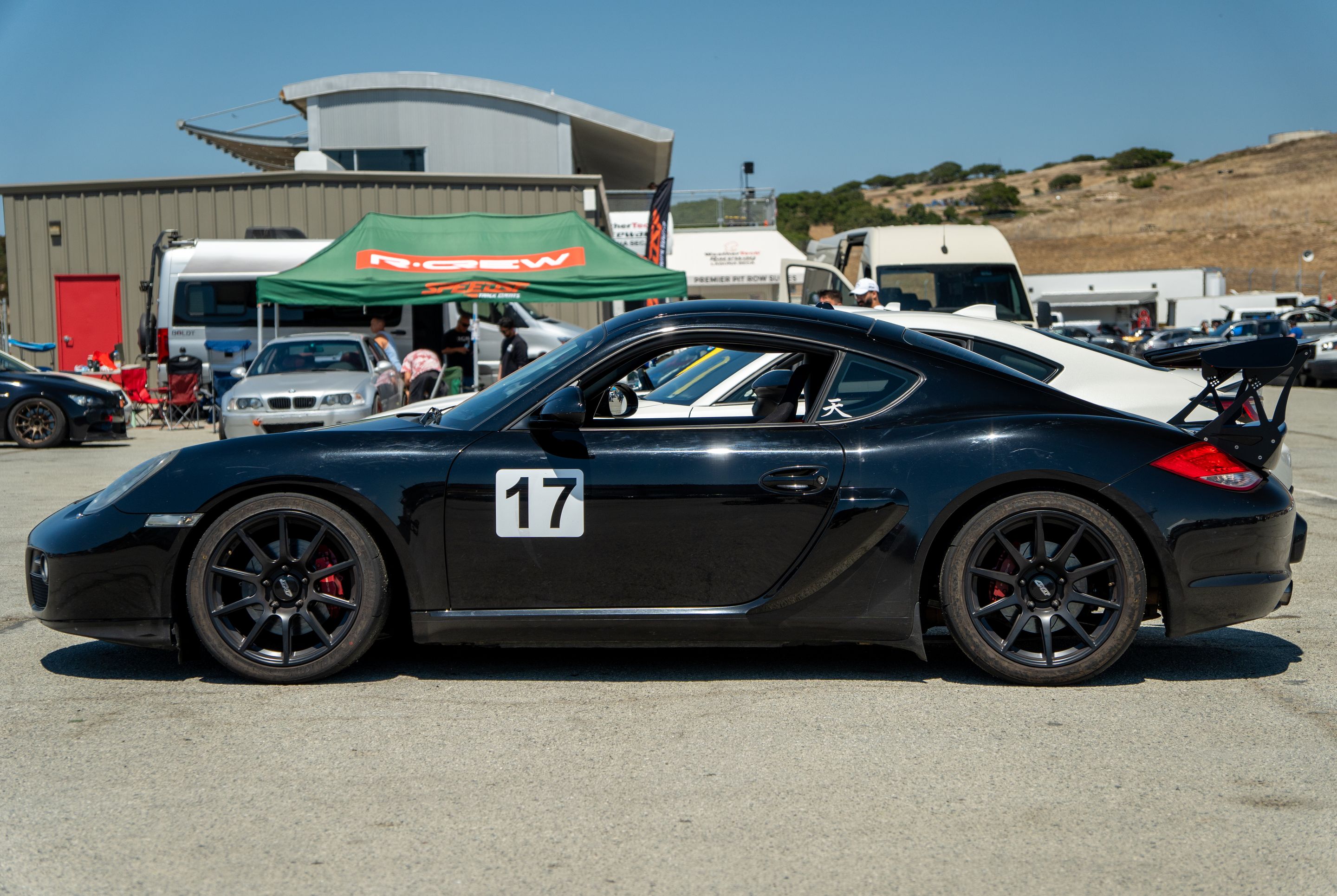 Black Porsche 987 Cayman S with 18" SM-10 Apex wheels in Satin Black