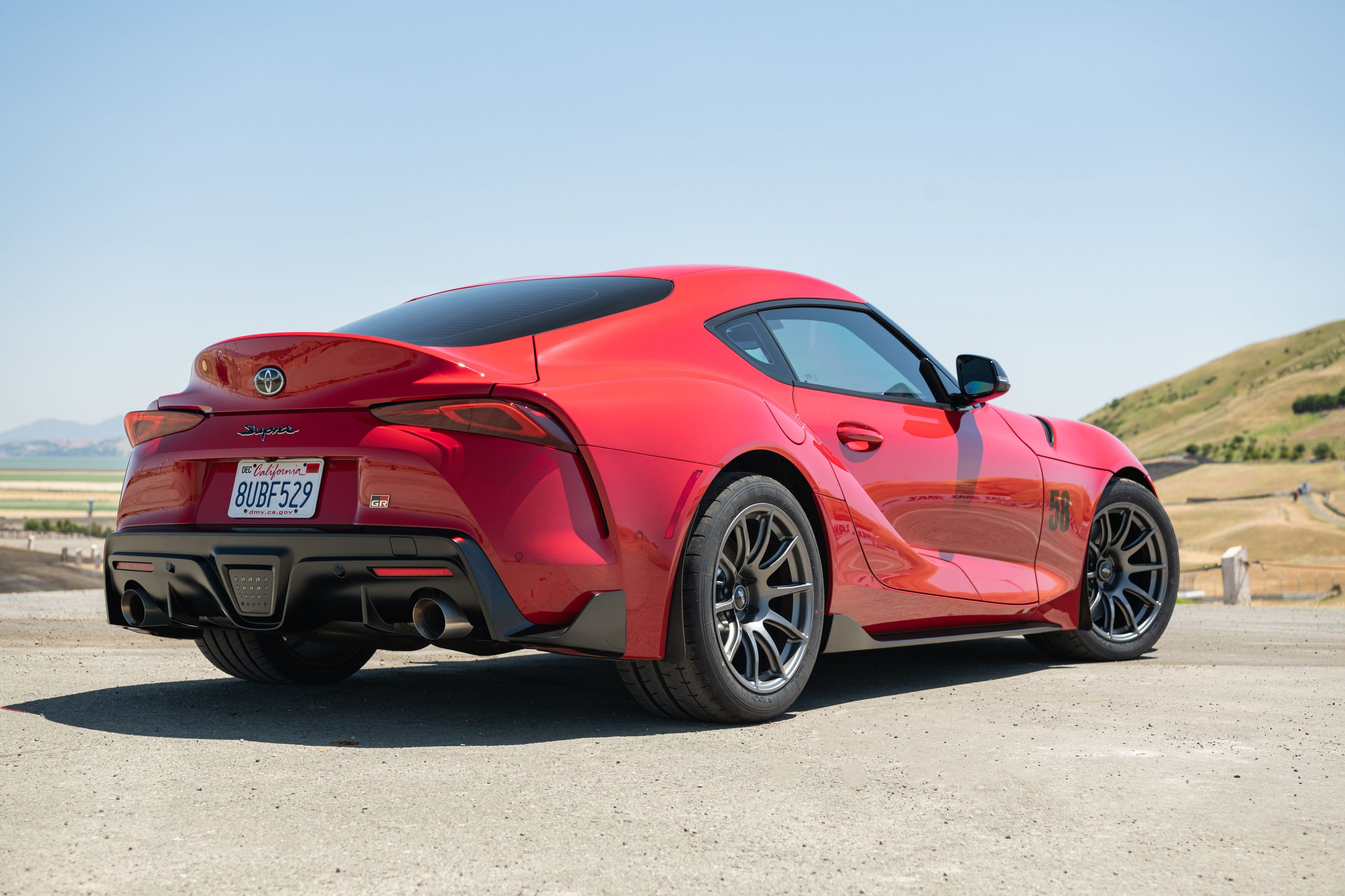 Red Toyota GR Supra with 18" SM-10 Apex wheels in Anthracite