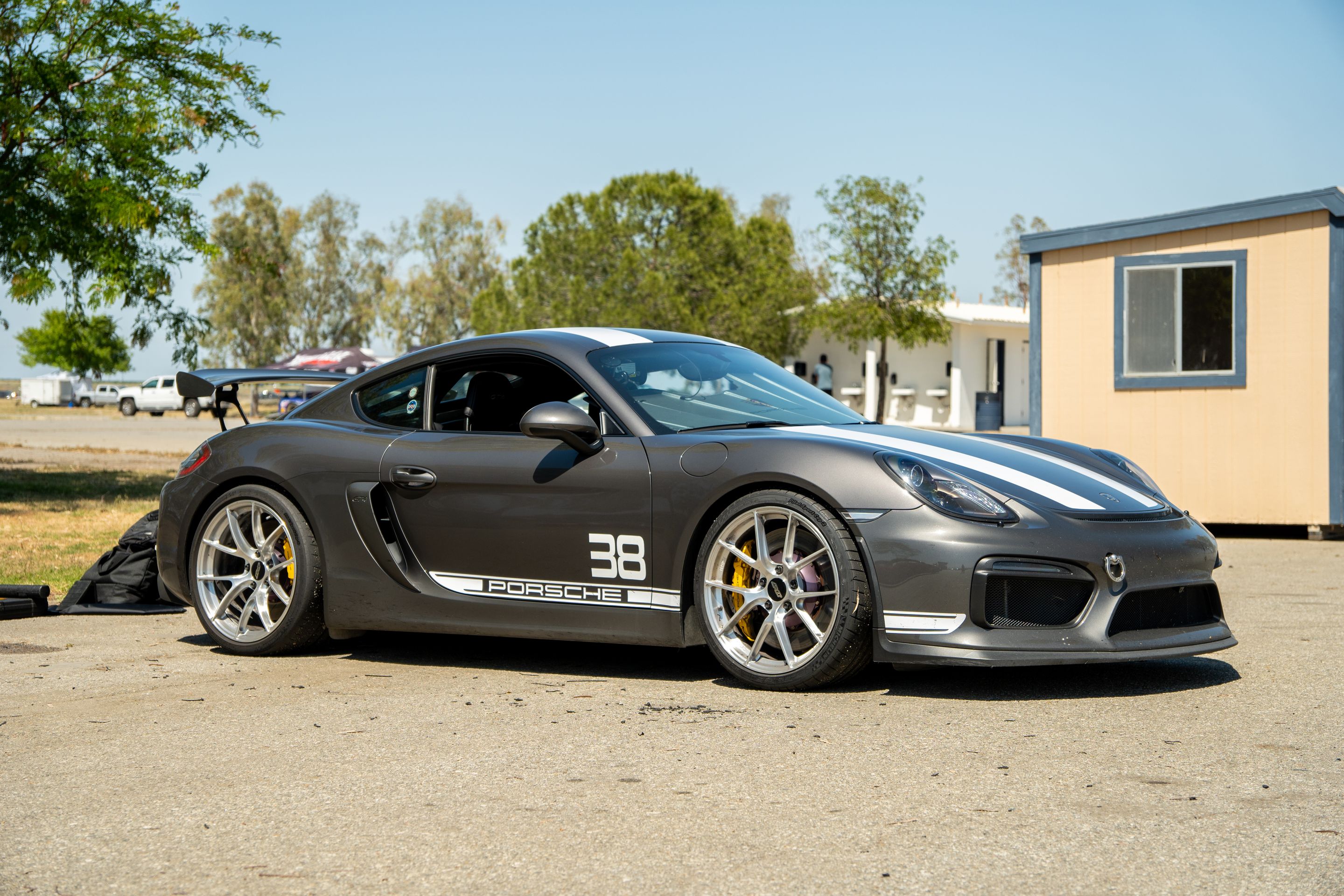 Grey Porsche 981 Cayman GT4 with 20" VS-5RS Apex wheels in Brushed Clear
