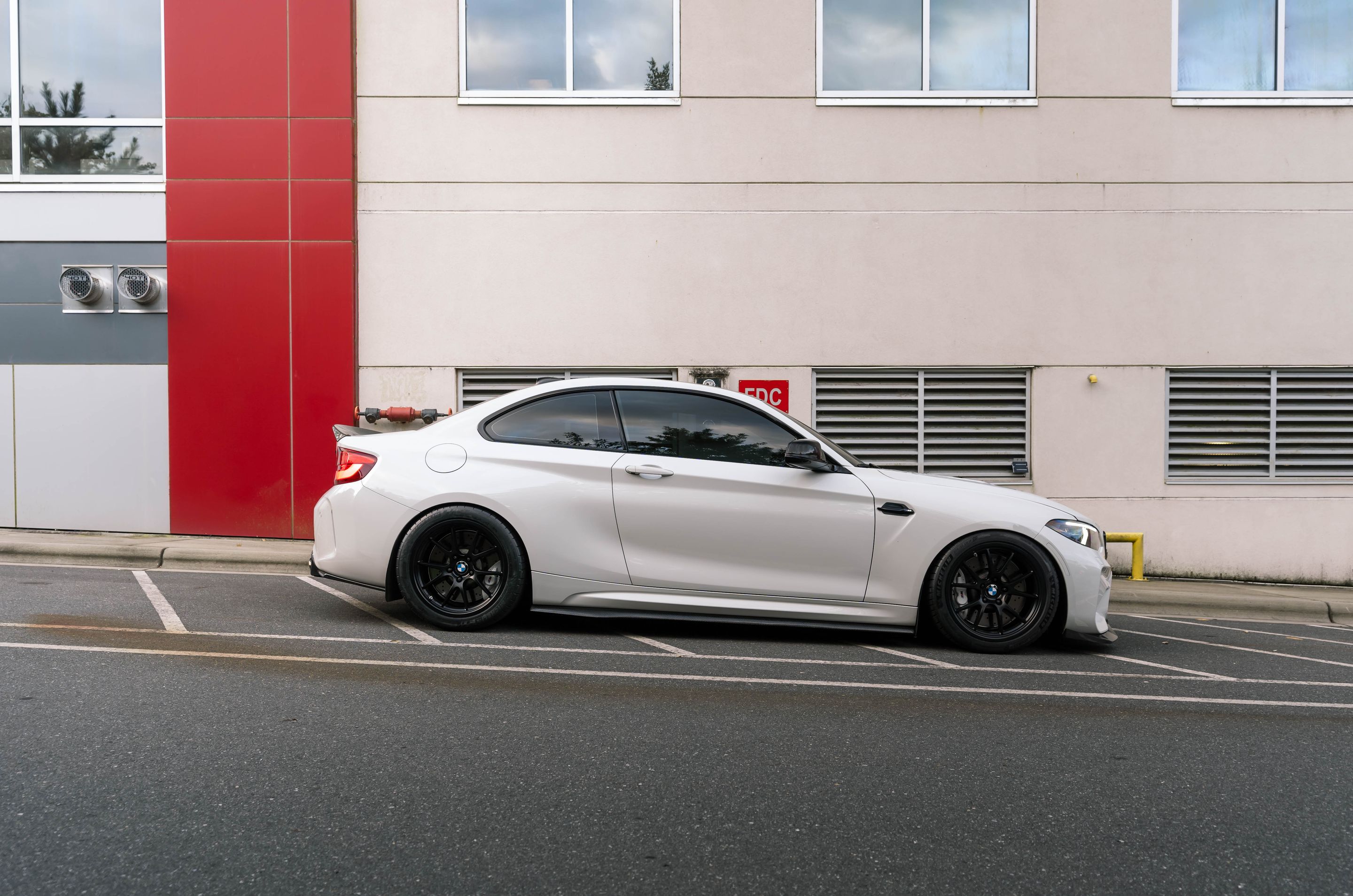 White BMW F87 M2 with 18" FL-5 Apex wheels in Satin Black