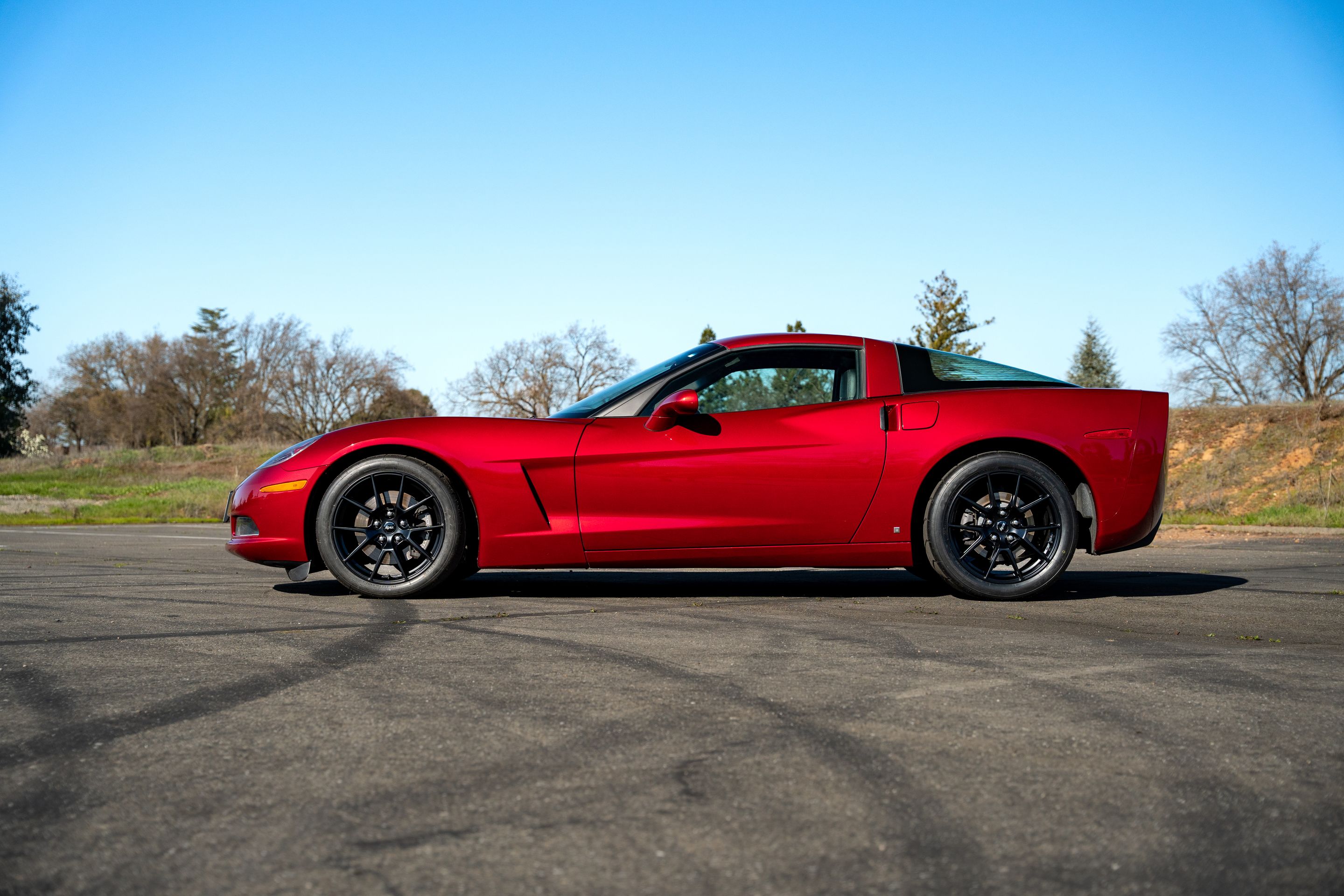 Red Chevrolet C6 Corvette Base/Z51 with 18" VS-5 Apex wheels in Satin Black