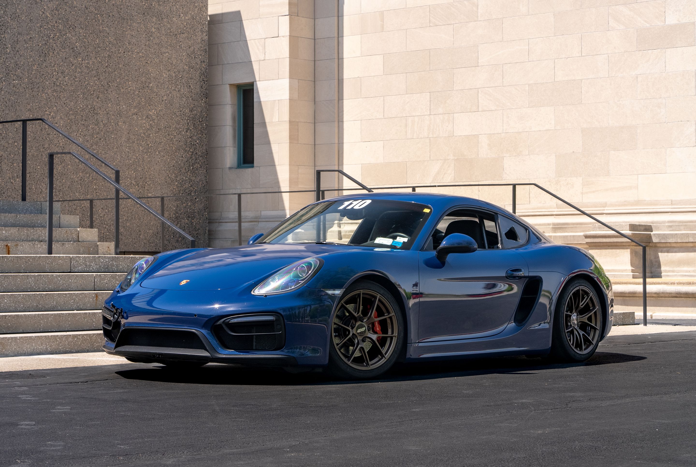 Blue Porsche 981 Cayman GTS with 18" VS-5RS Apex wheels in Satin Bronze