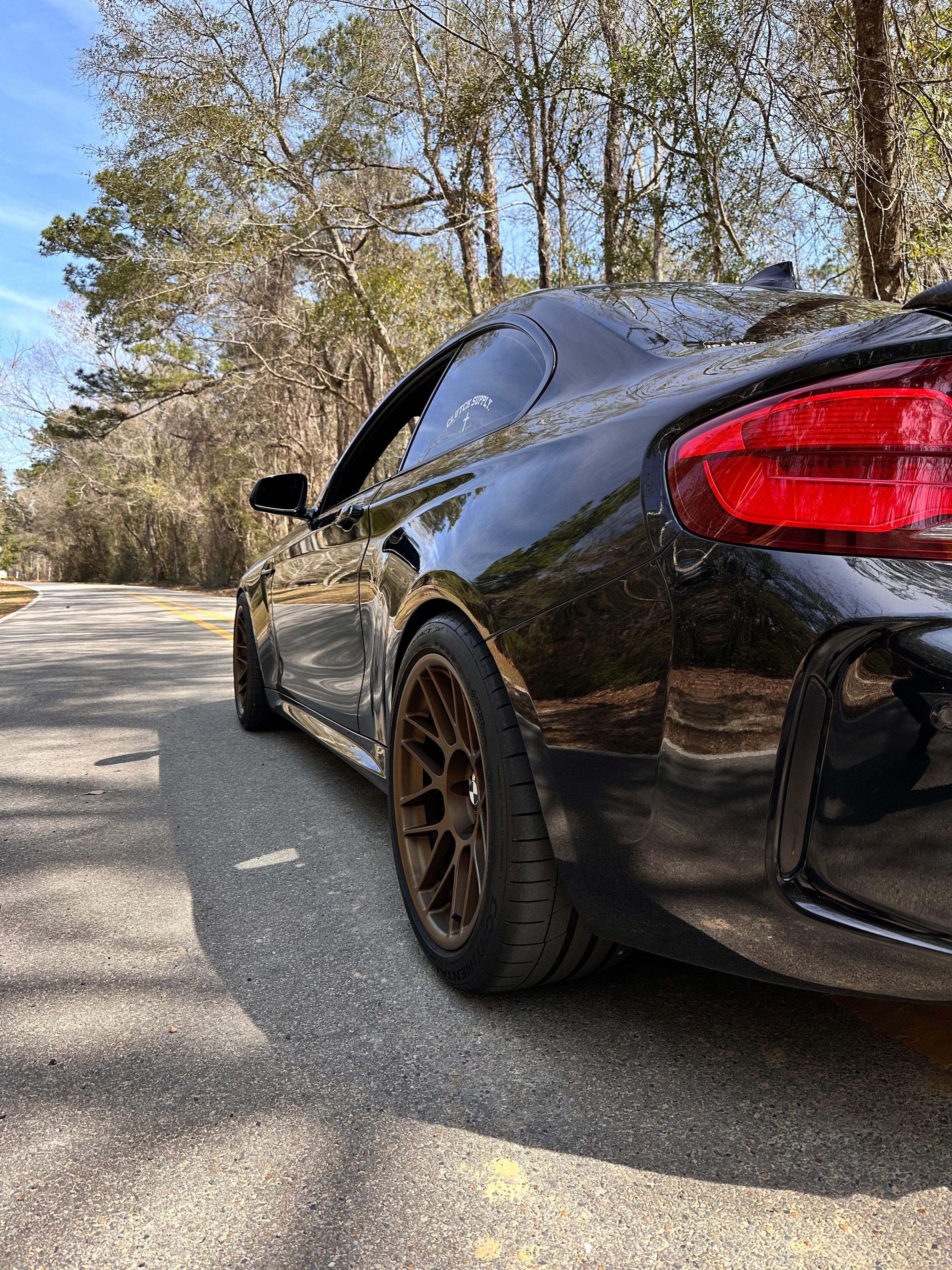 Black BMW F87 M2 with 18" ARC-8 Apex wheels in Satin Bronze
