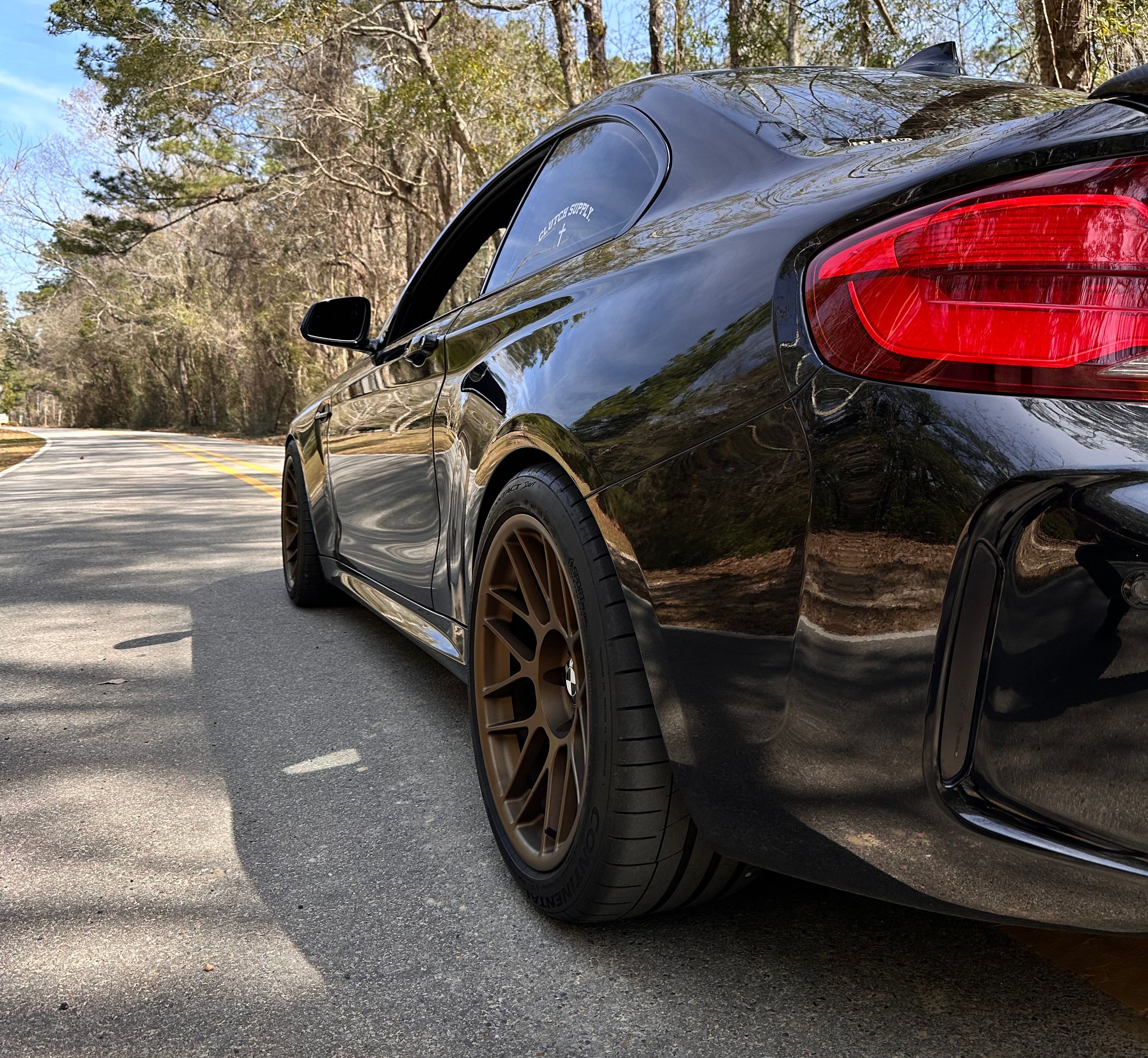 Black BMW F87 M2 with 18" ARC-8 Apex wheels in Satin Bronze
