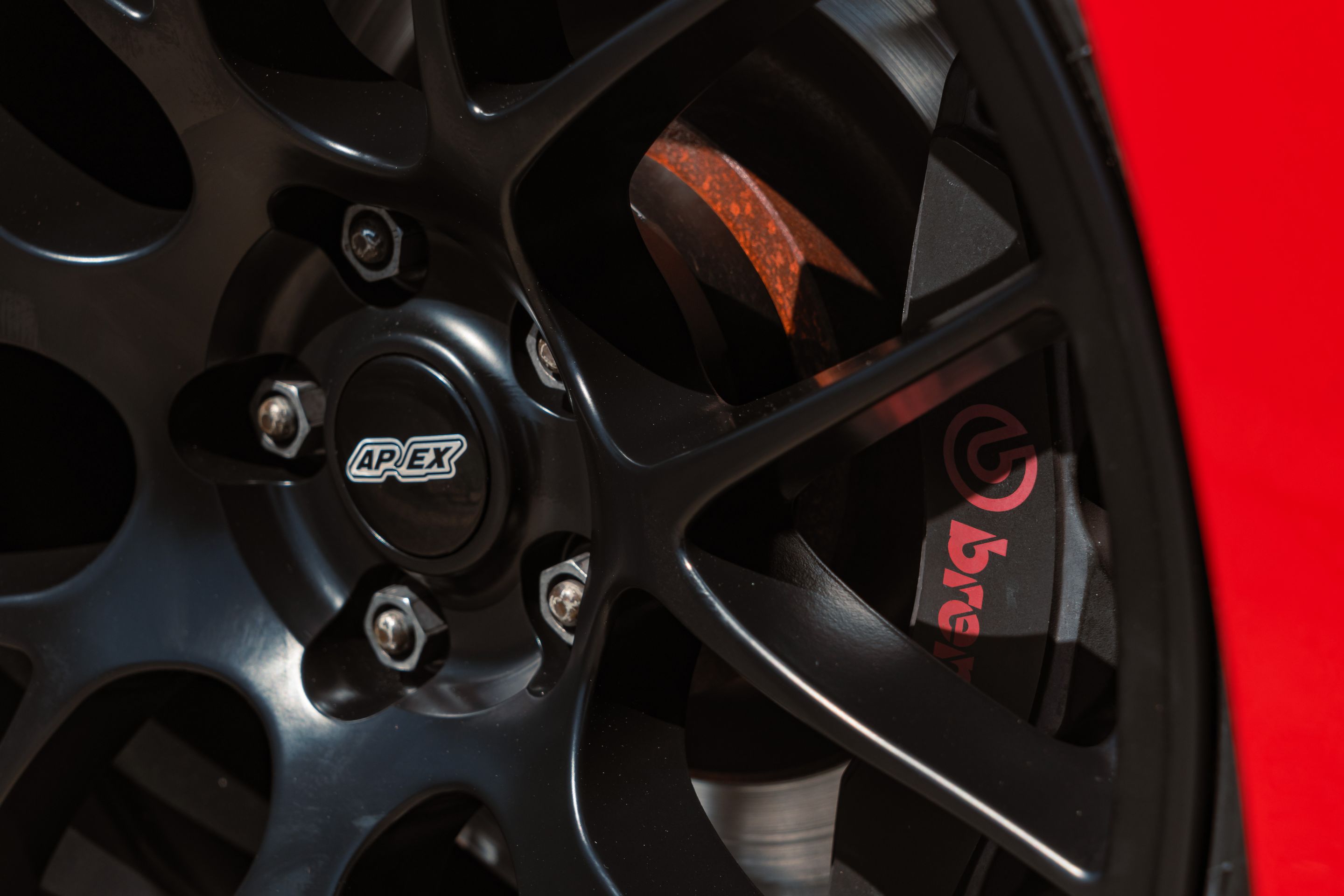 Red Ford S550 Mustang GT with 19" EC-7 Apex wheels in Satin Black