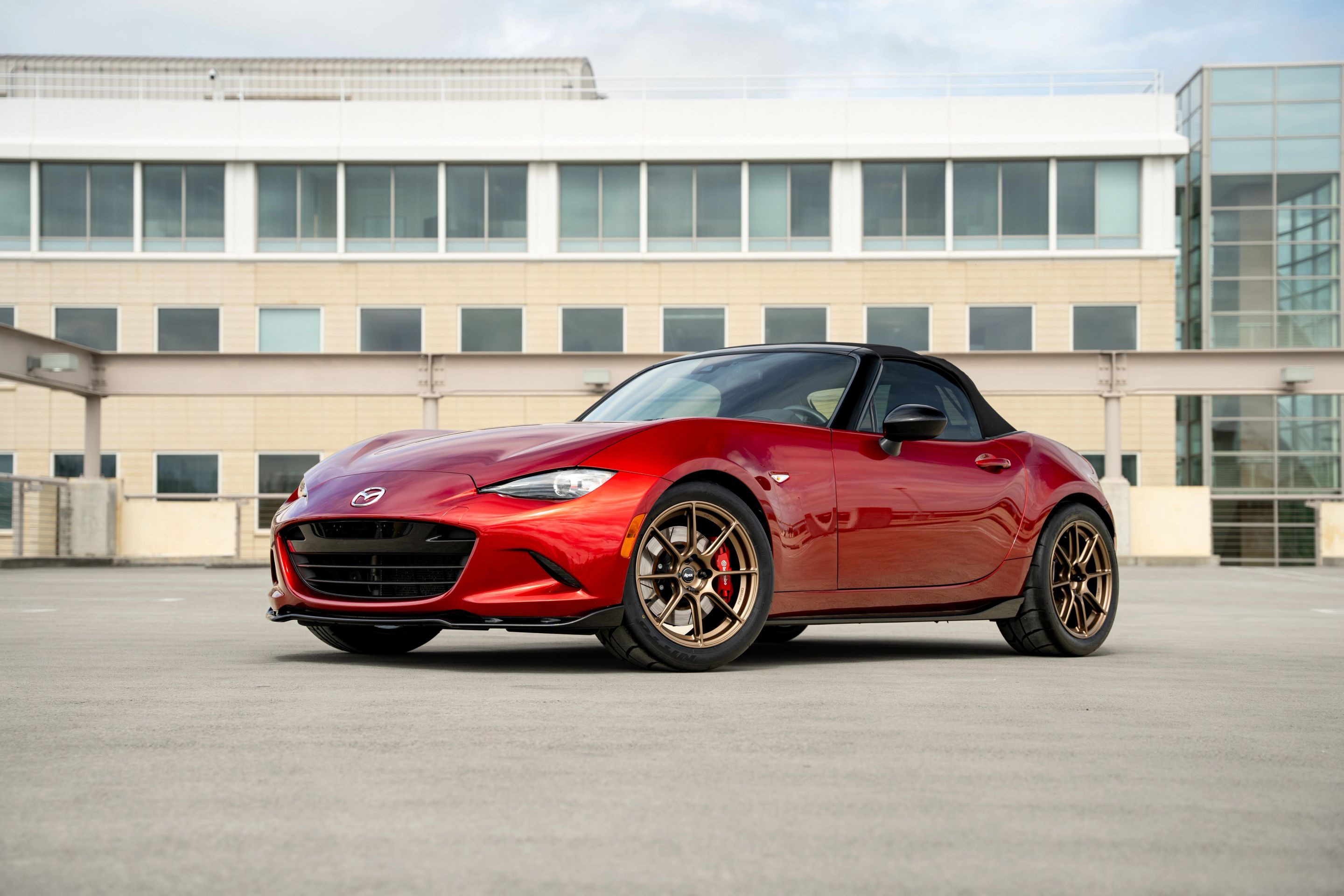 Red Mazda ND MX-5 Miata with 17" SM-8RS Apex wheels in Satin Bronze
