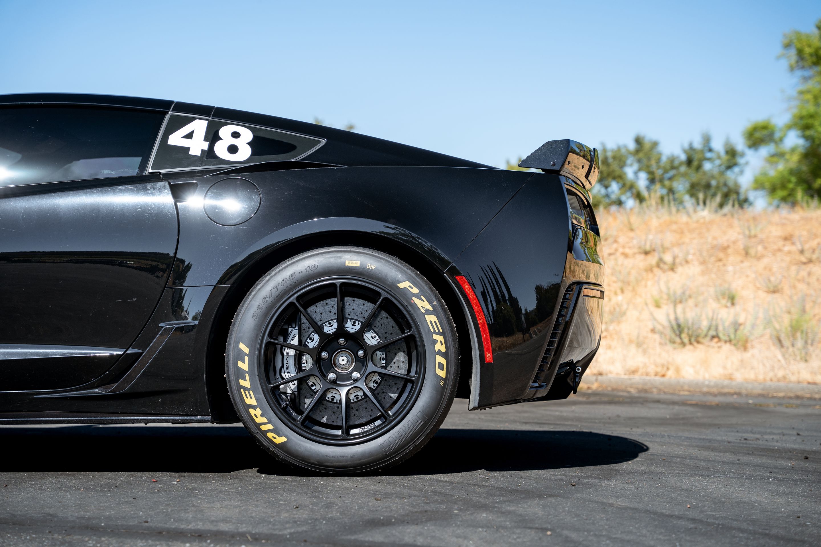 Black Chevrolet C7 Corvette Z06 with 18" SM-10RE Apex wheels in Satin Black