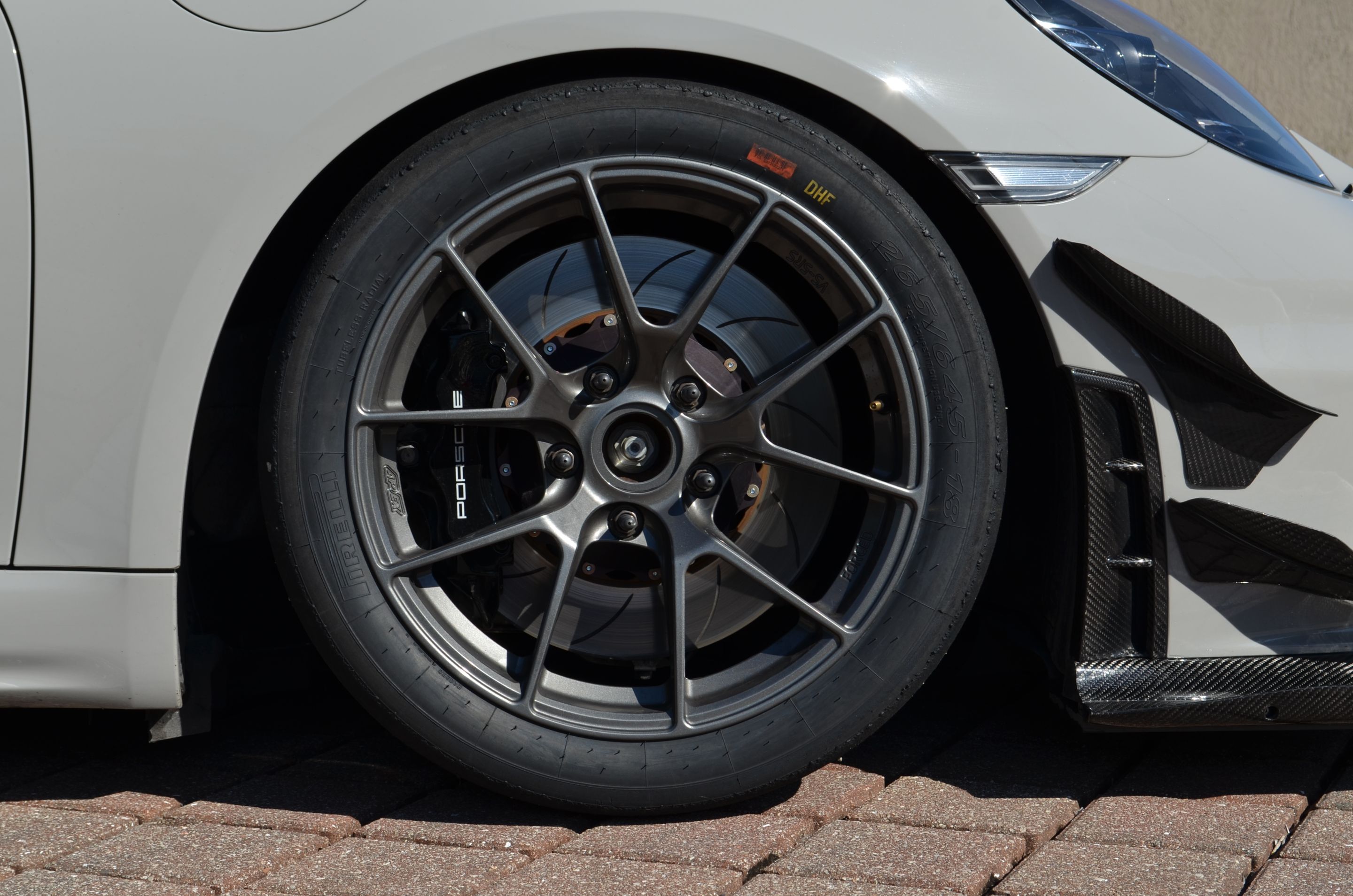Grey Porsche 718 Cayman GT4 with 18" VS-5RS Apex wheels in Anthracite