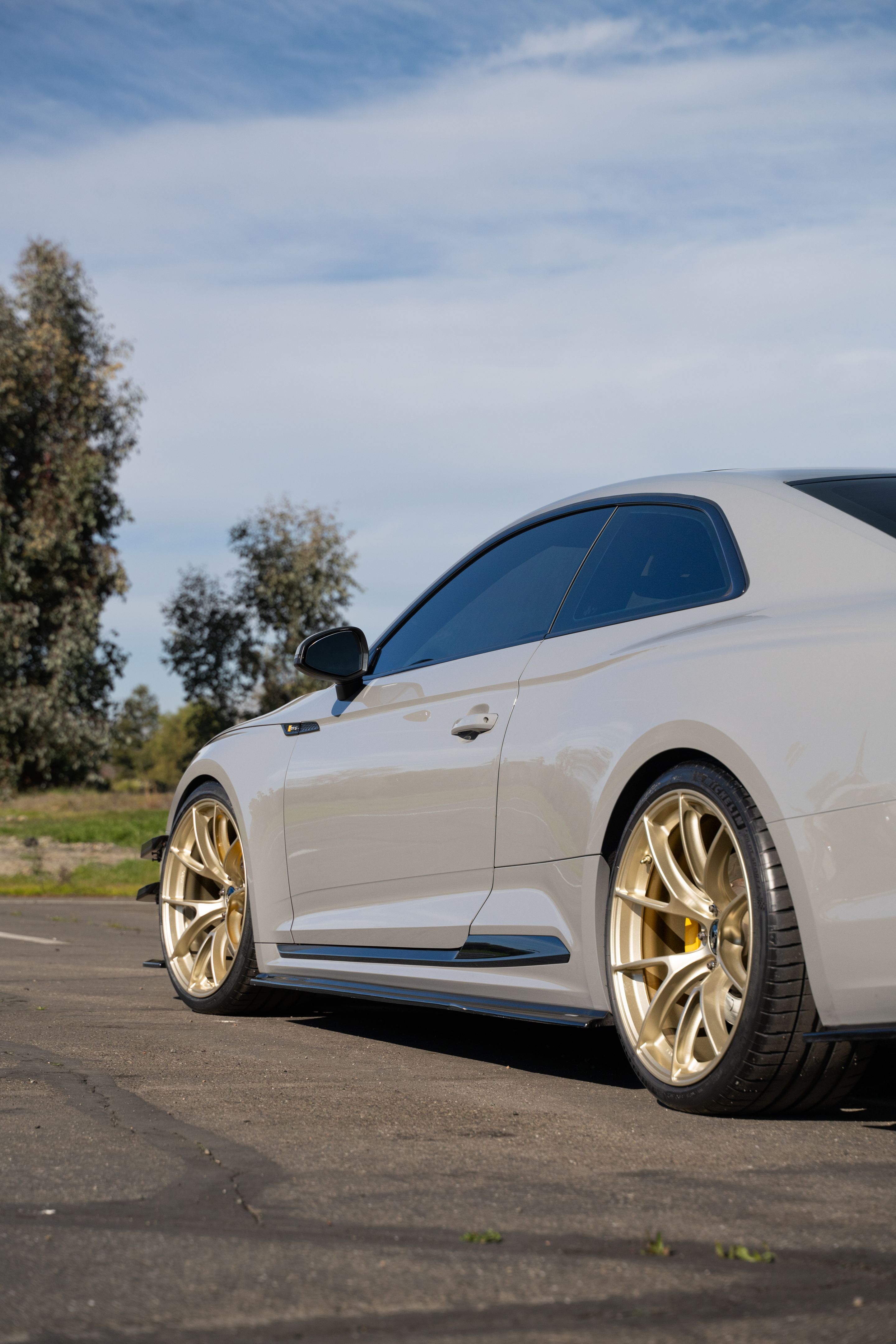 Grey Audi B9 RS 5 Coupe with 20" VS-5RS Apex wheels in Motorsport Gold