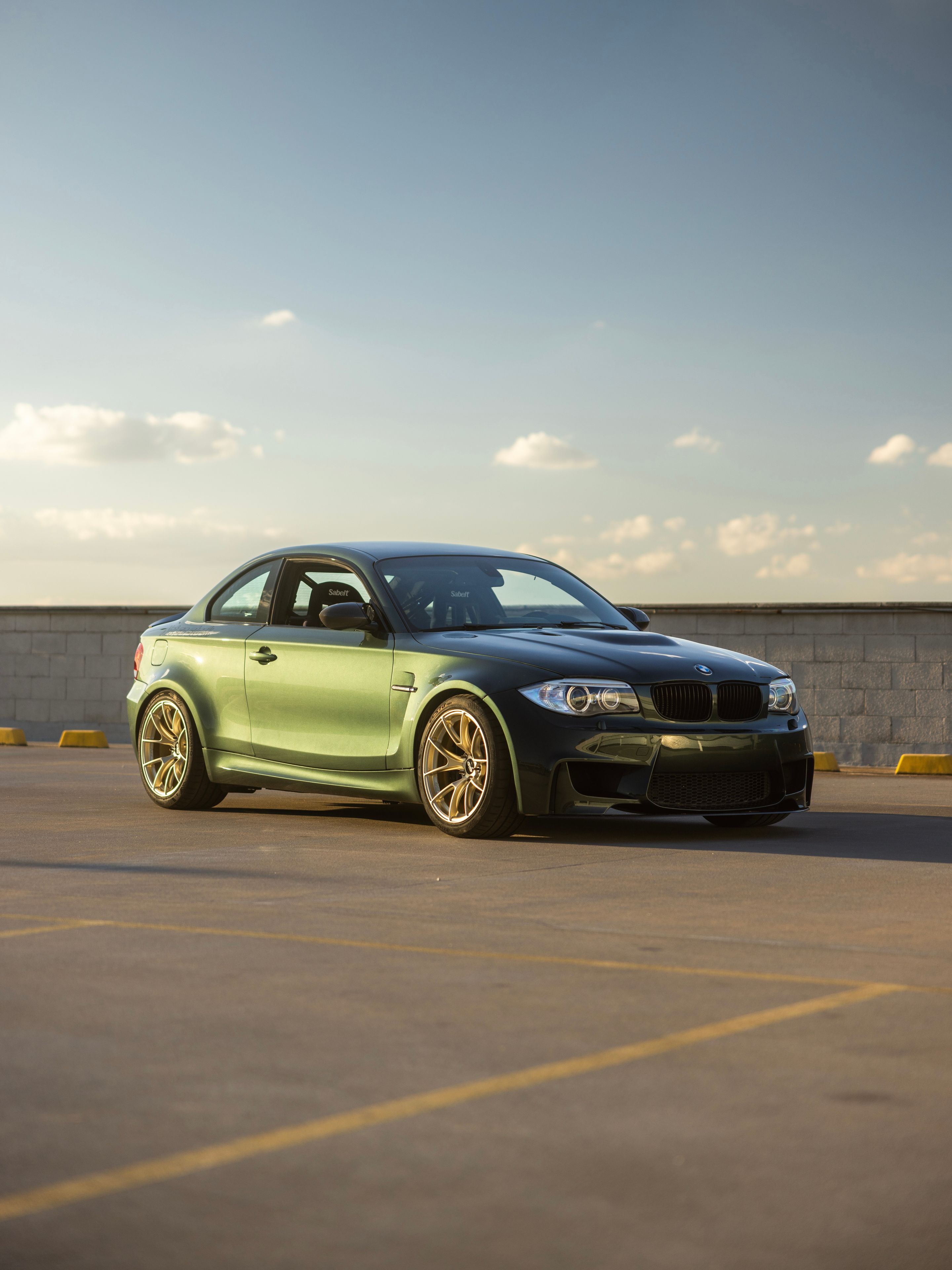 Green BMW E82 1M with 18" VS-5RS Apex wheels in Motorsport Gold