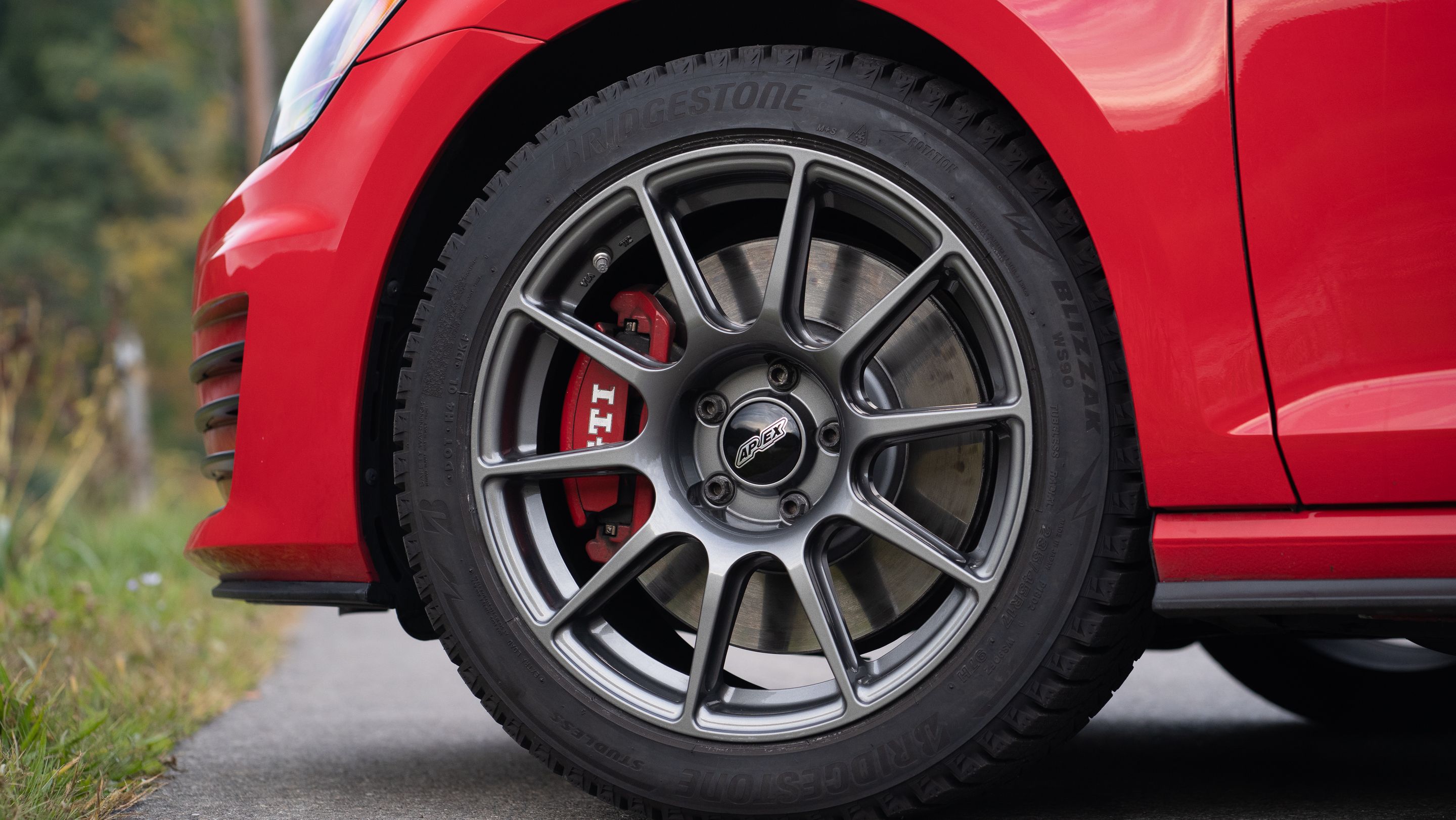 Red VW MK7 GTI with 17" SM-10 Apex wheels in Anthracite