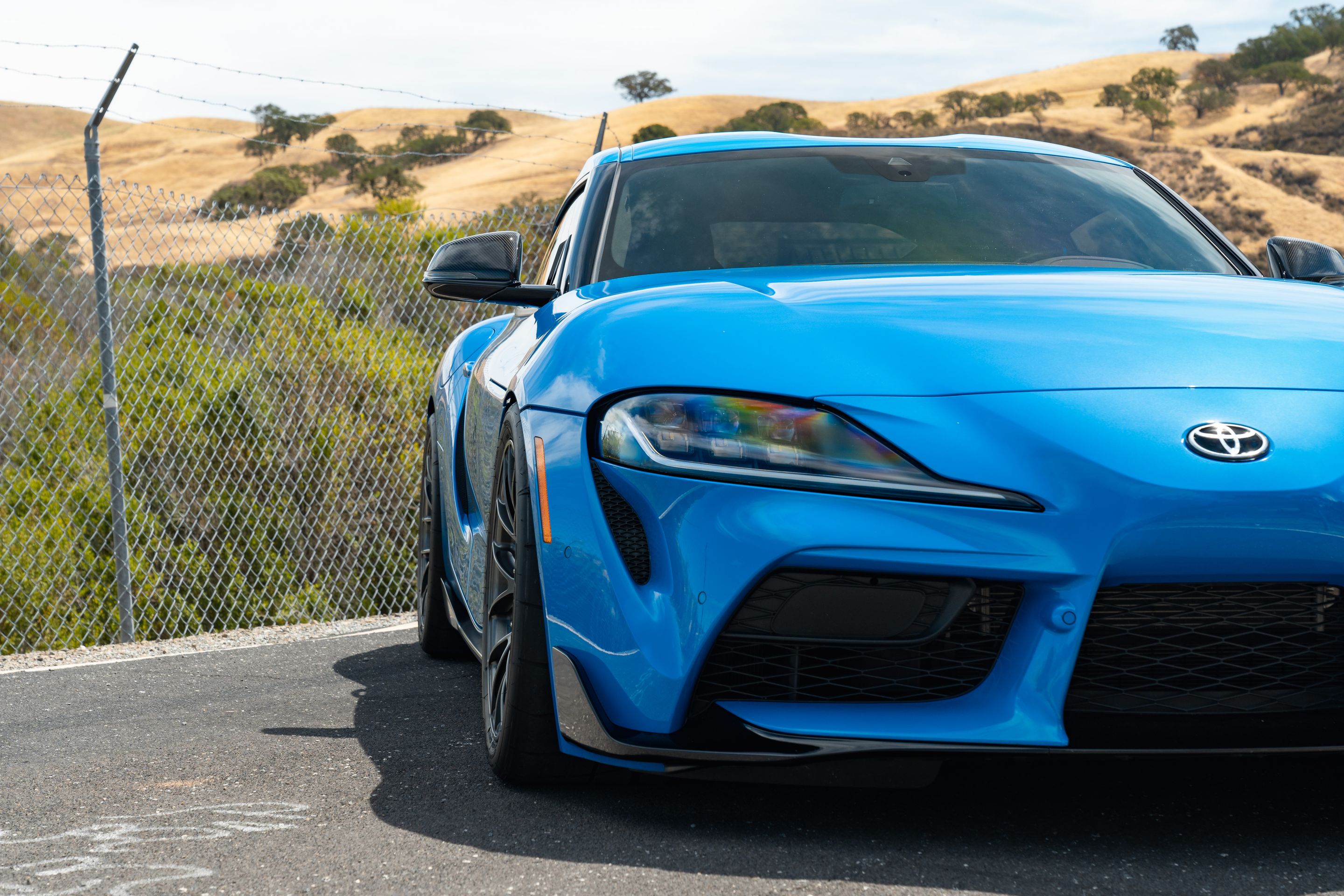 Blue Toyota GR Supra with 18" EC-7RS Apex wheels in Anthracite