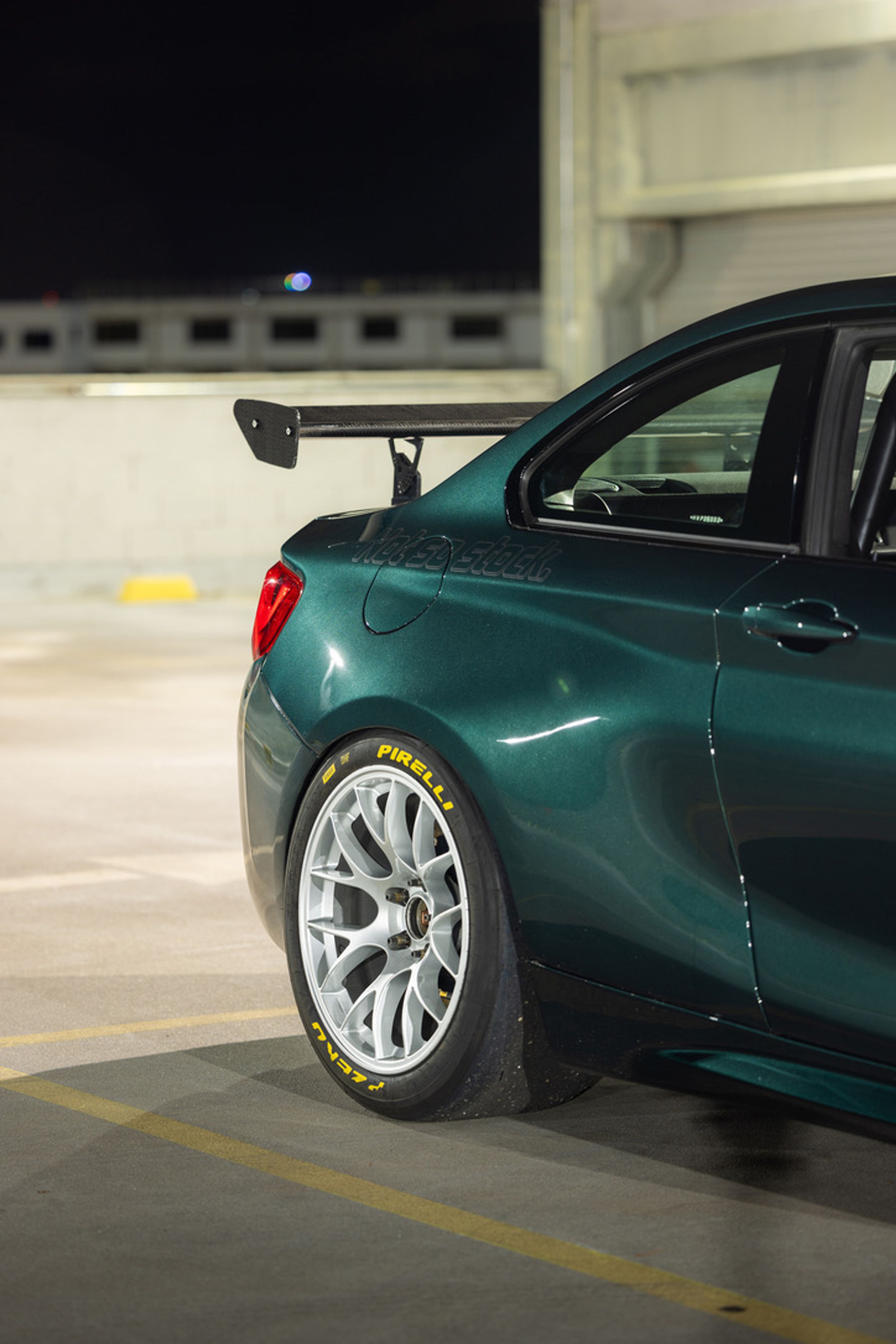 Green BMW F87 M2 with 18" EC-7 Apex wheels in Race Silver