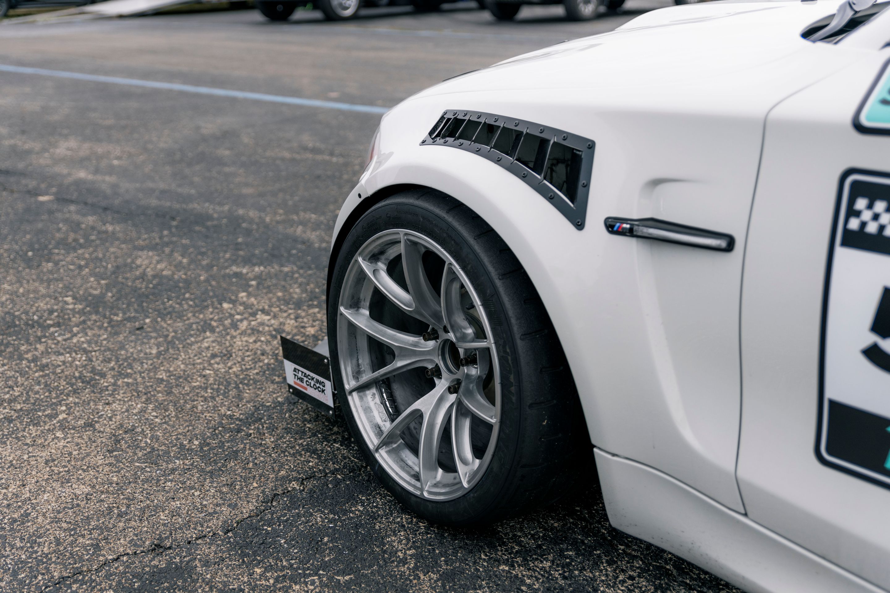 White BMW E82 1M with 18" VS-5RS Apex wheels in Brushed Clear