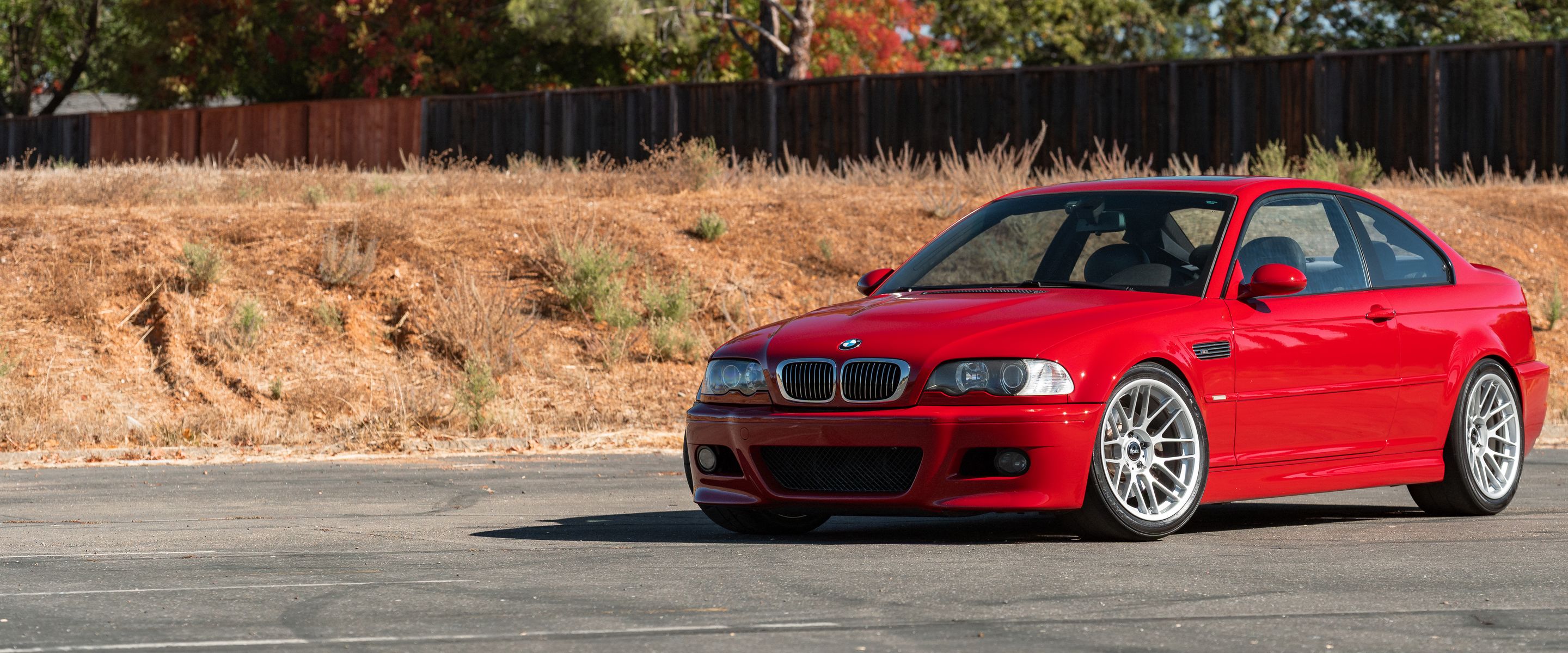 Red BMW E46 M3 with 18" ARC-8RT Apex wheels in Race Silver