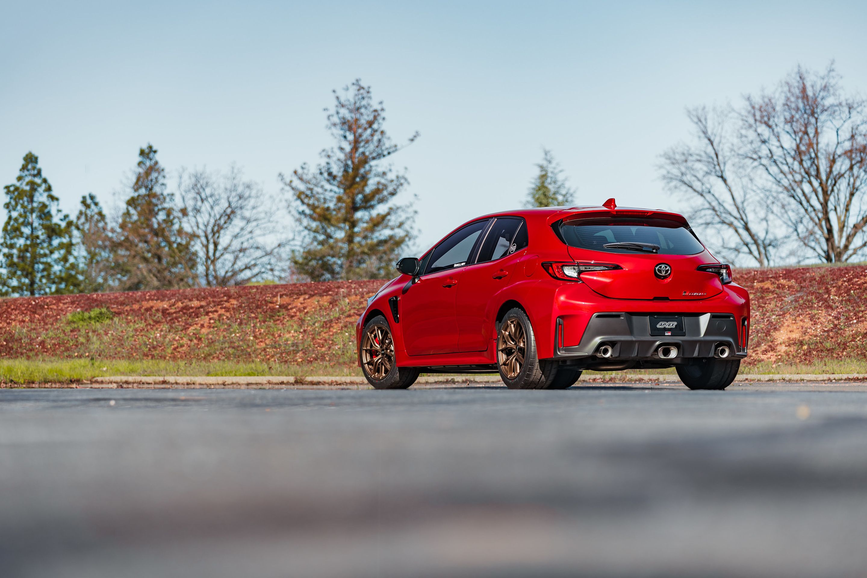 Red Toyota GR Corolla with 17" VS-5RS Apex wheels in Satin Bronze