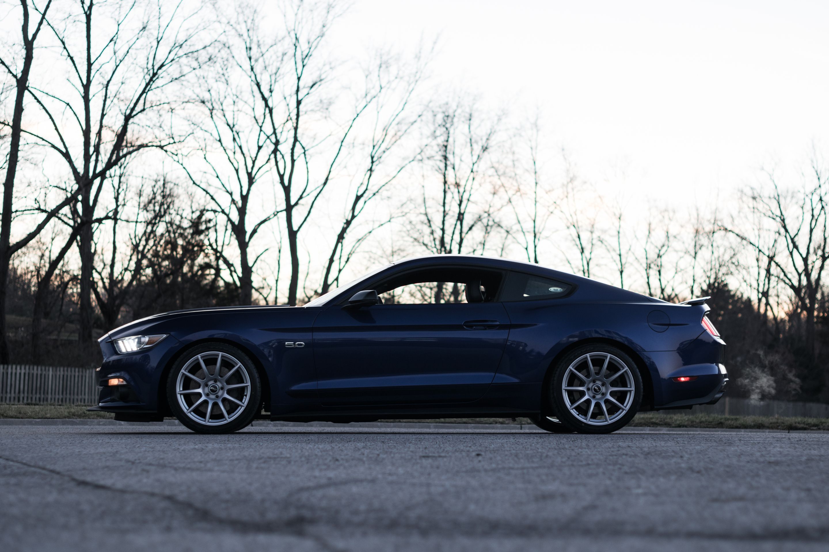 Blue Ford S550 Mustang GT with 19" SM-10 Apex wheels in Race Silver