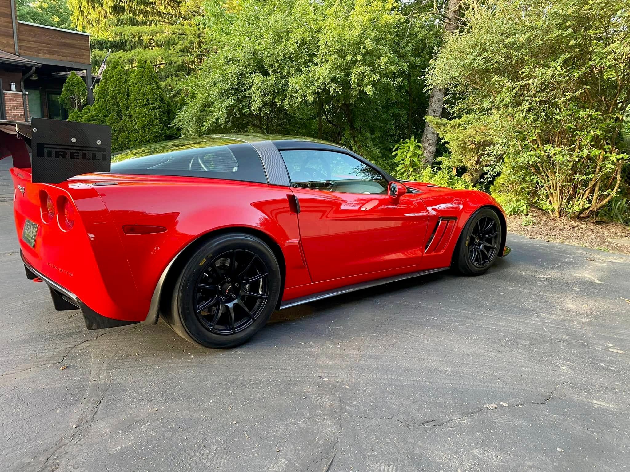 Red Chevrolet C6 Corvette Grand Sport with 18" SM-10 Apex wheels in Satin Black