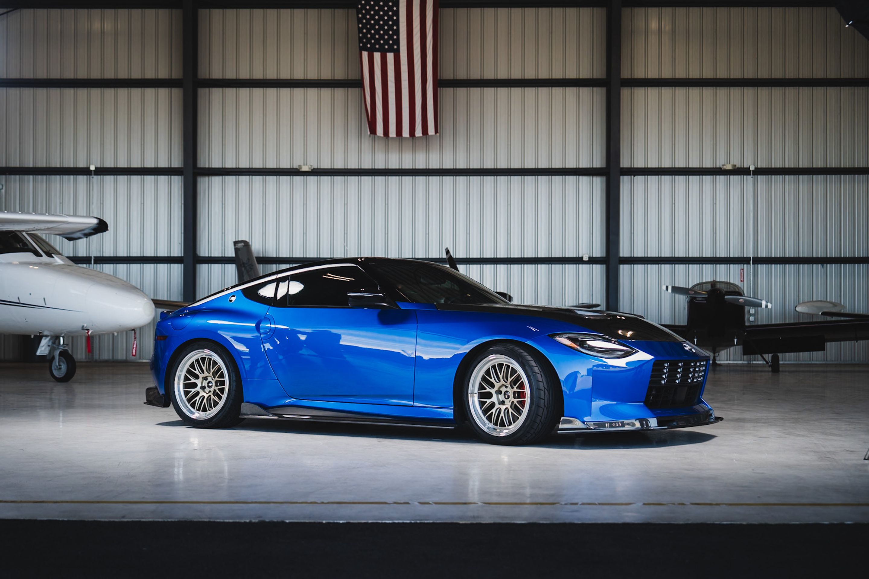 Blue Nissan Z with 19" ML-10RT Apex wheels in Machined Lip Gloss Motorsport Gold