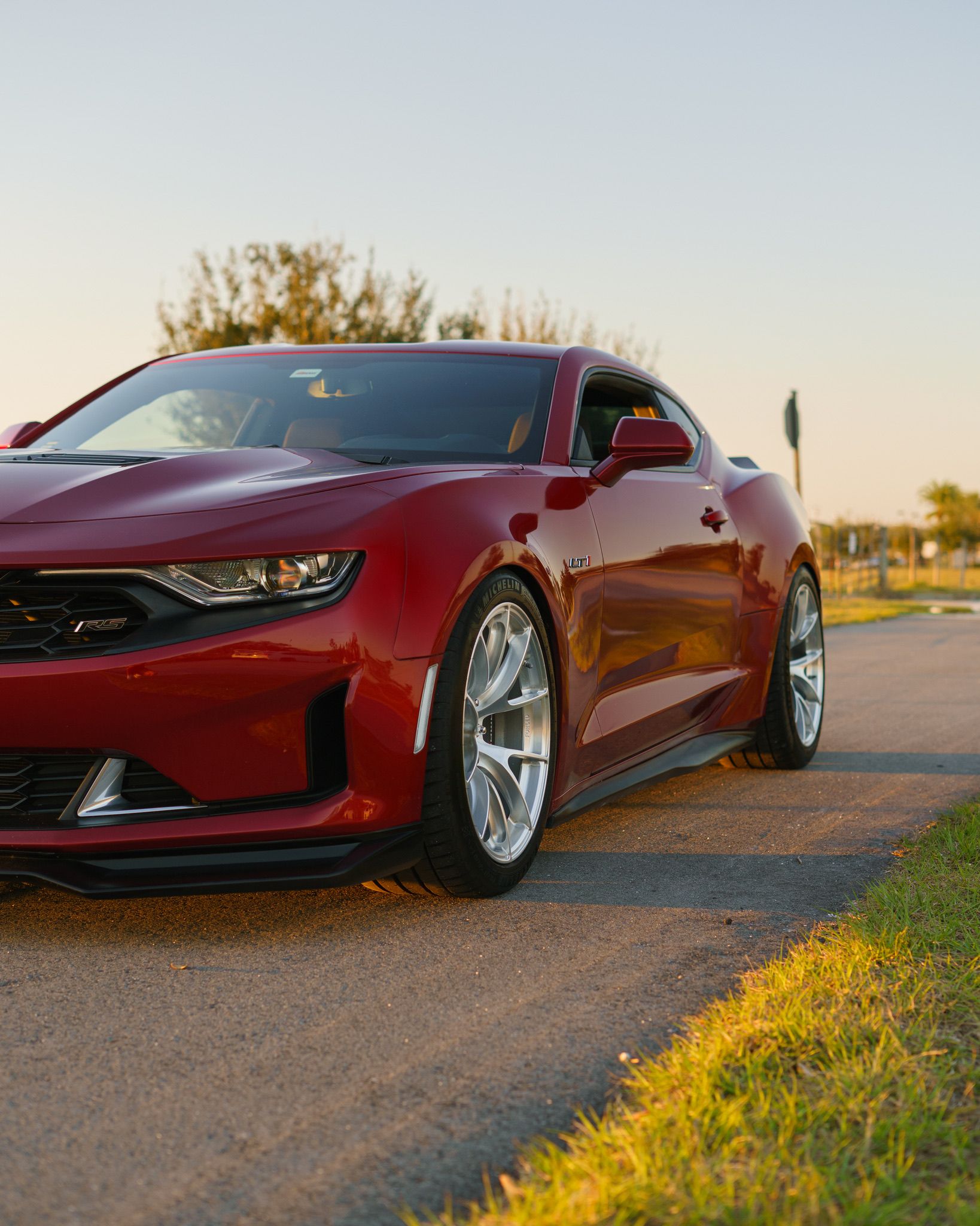 Red Chevrolet 6th Gen Camaro LT1 with 19" VS-5RS Apex wheels in Brushed Clear