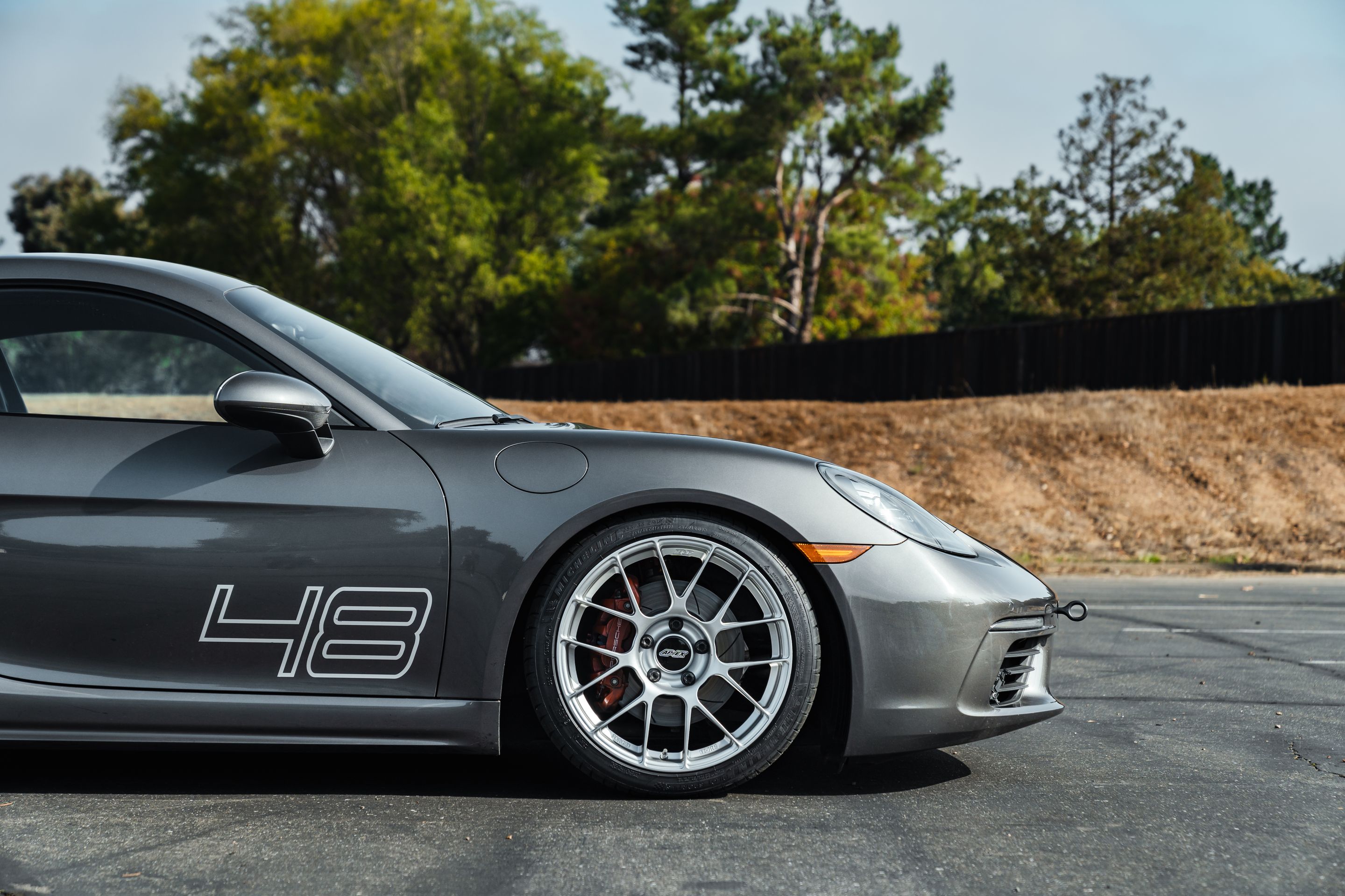 Grey Porsche 718 Cayman S with 19" EC-7RS Apex wheels in Race Silver